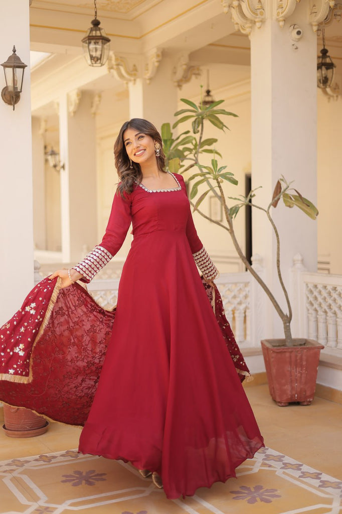 Embrace timeless elegance with our meticulously crafted Vichitra silk Maroon gown and dupatta set. ClothsVilla