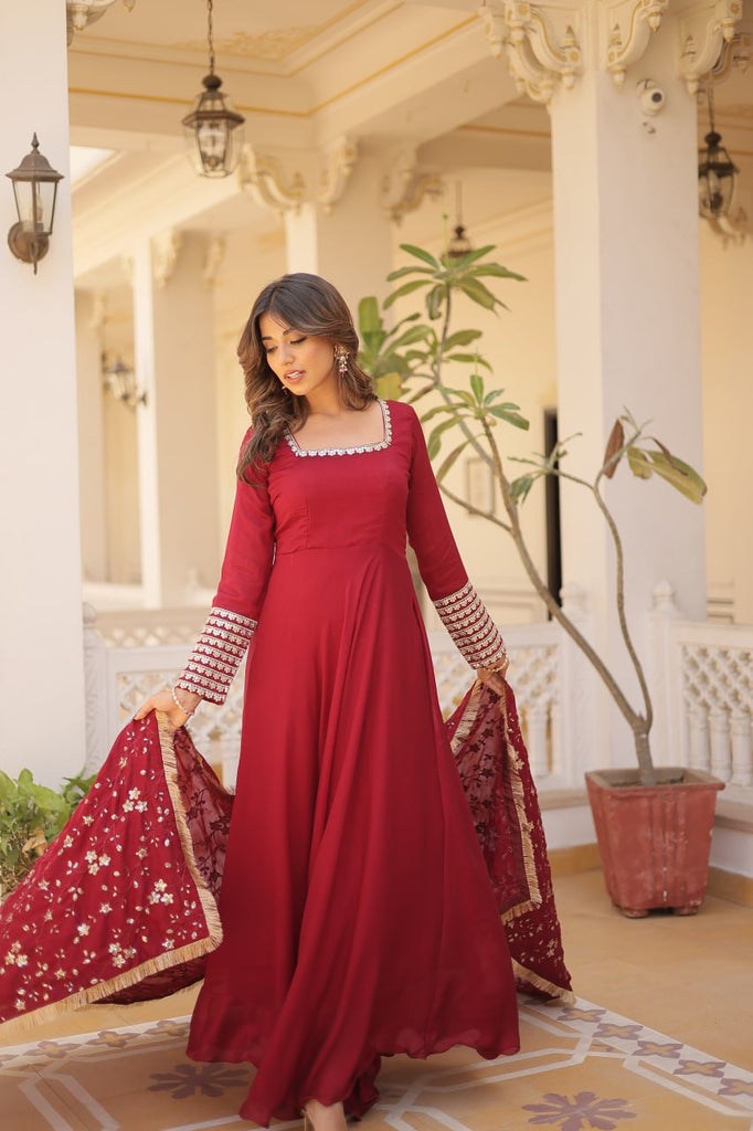 Embrace timeless elegance with our meticulously crafted Vichitra silk Maroon gown and dupatta set. ClothsVilla