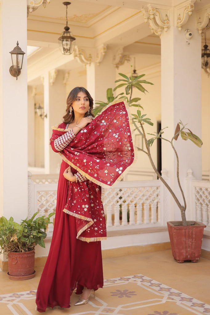 Embrace timeless elegance with our meticulously crafted Vichitra silk Maroon gown and dupatta set. ClothsVilla