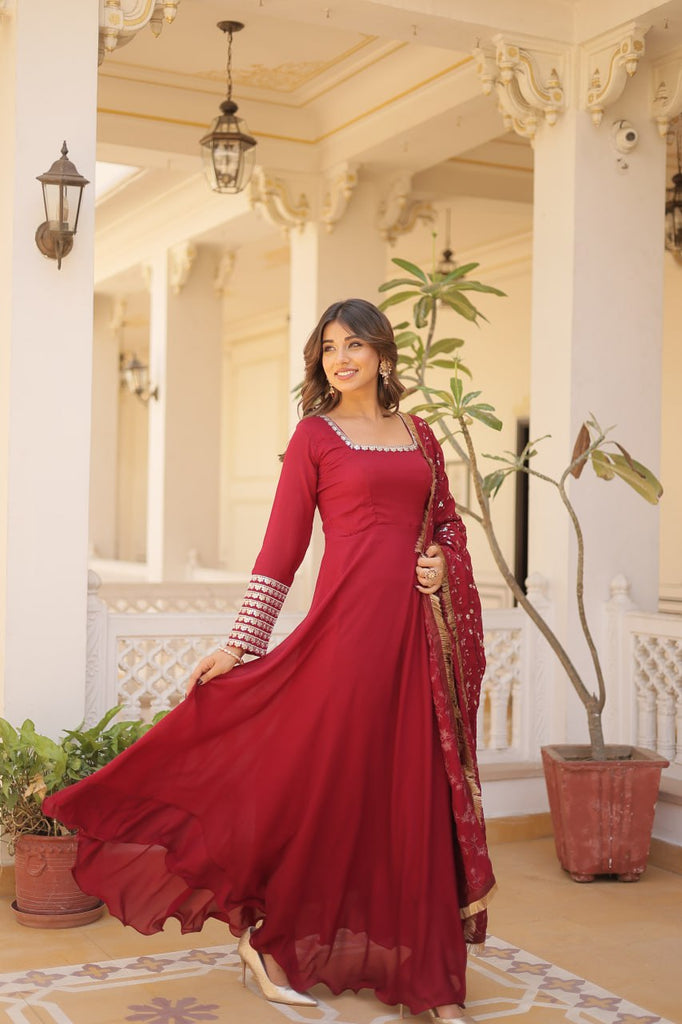 Embrace timeless elegance with our meticulously crafted Vichitra silk Maroon gown and dupatta set. ClothsVilla