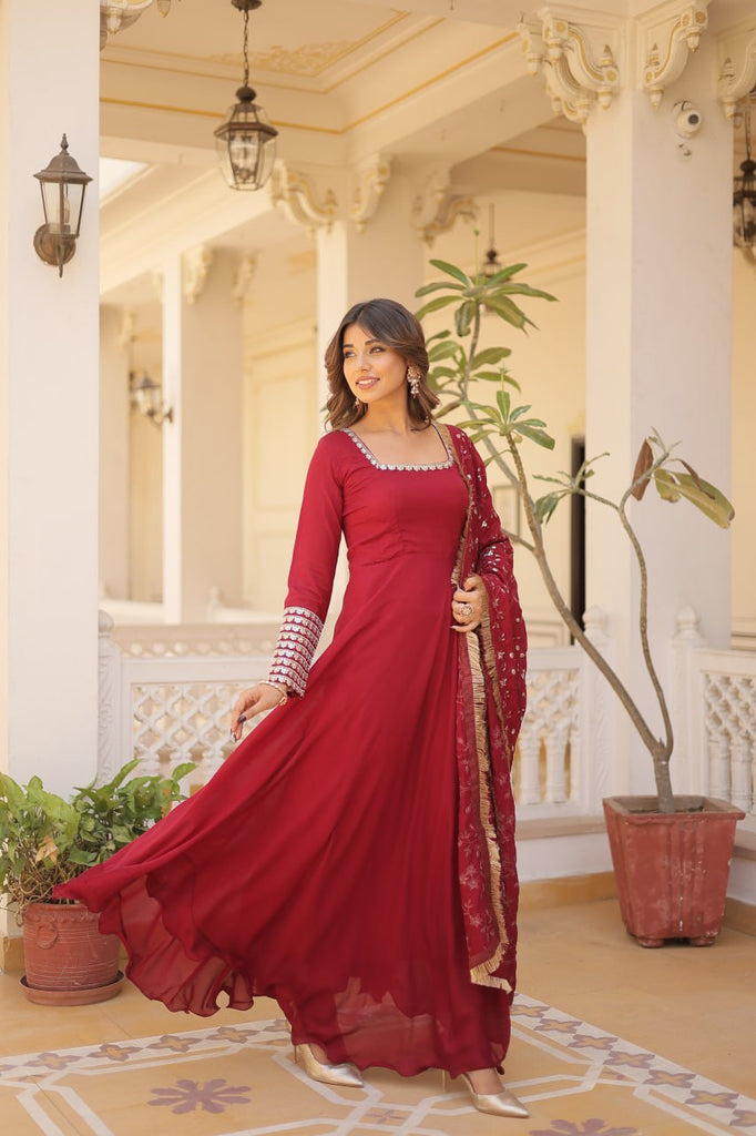 Embrace timeless elegance with our meticulously crafted Vichitra silk Maroon gown and dupatta set. ClothsVilla