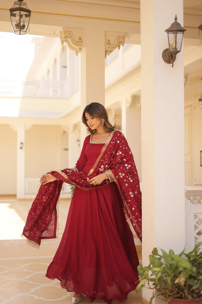 Embrace timeless elegance with our meticulously crafted Vichitra silk Maroon gown and dupatta set. ClothsVilla