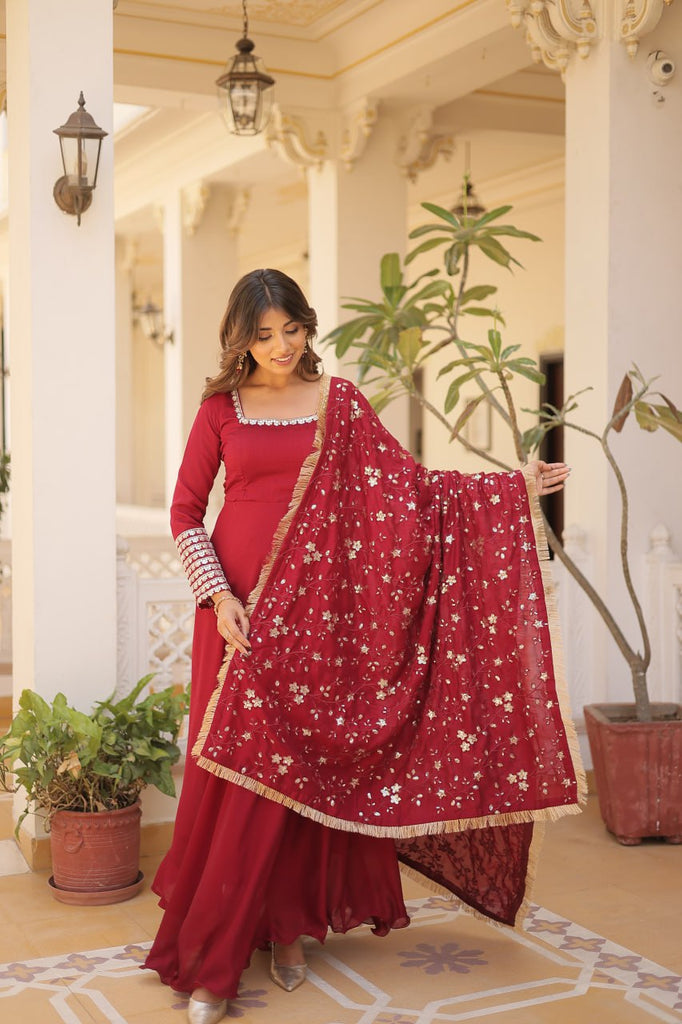 Embrace timeless elegance with our meticulously crafted Vichitra silk Maroon gown and dupatta set. ClothsVilla