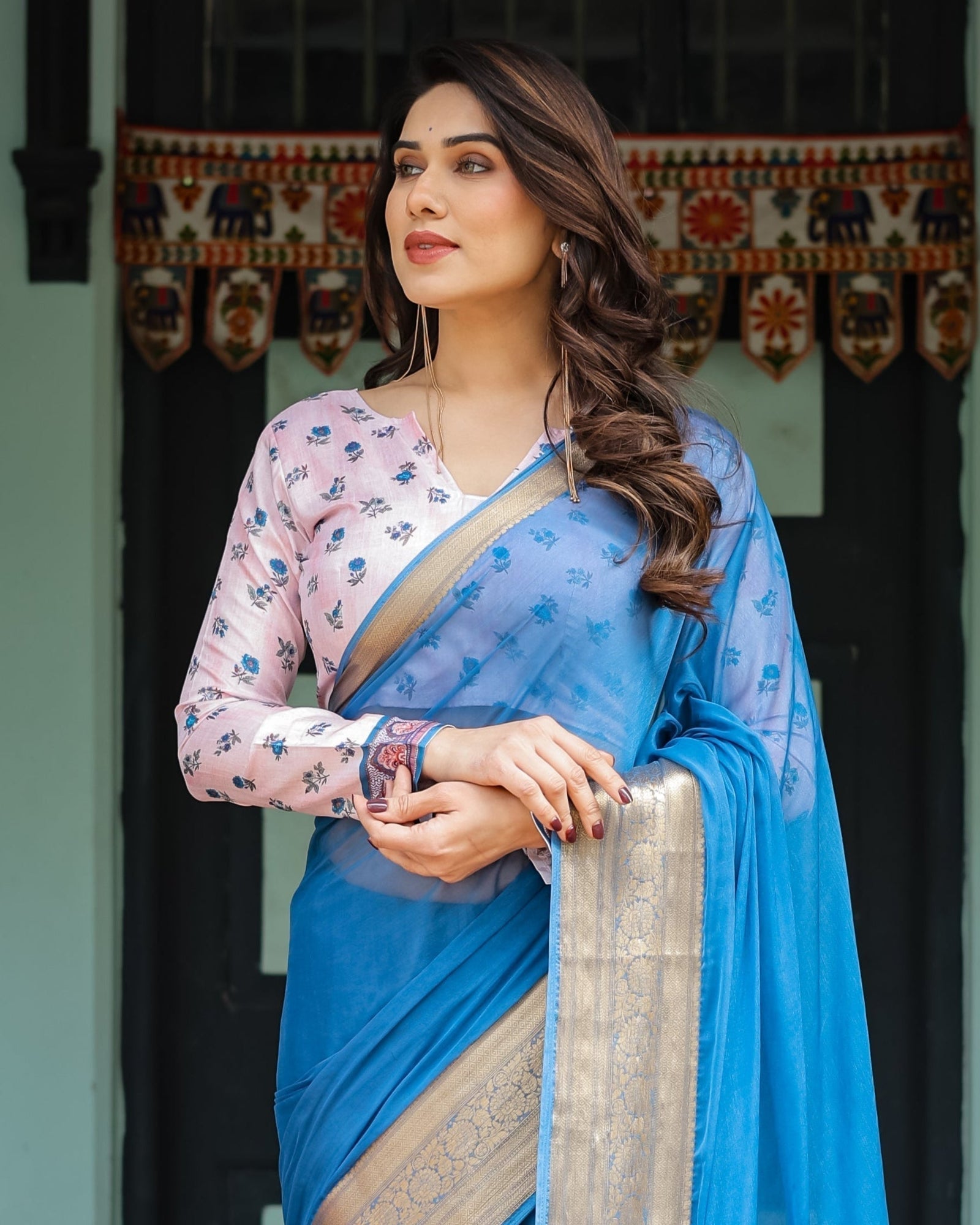 Vibrant Sky Blue Plain Chiffon Saree with Gold Zari Border, Floral Printed Blouse & Tassel Accents CHIFFON