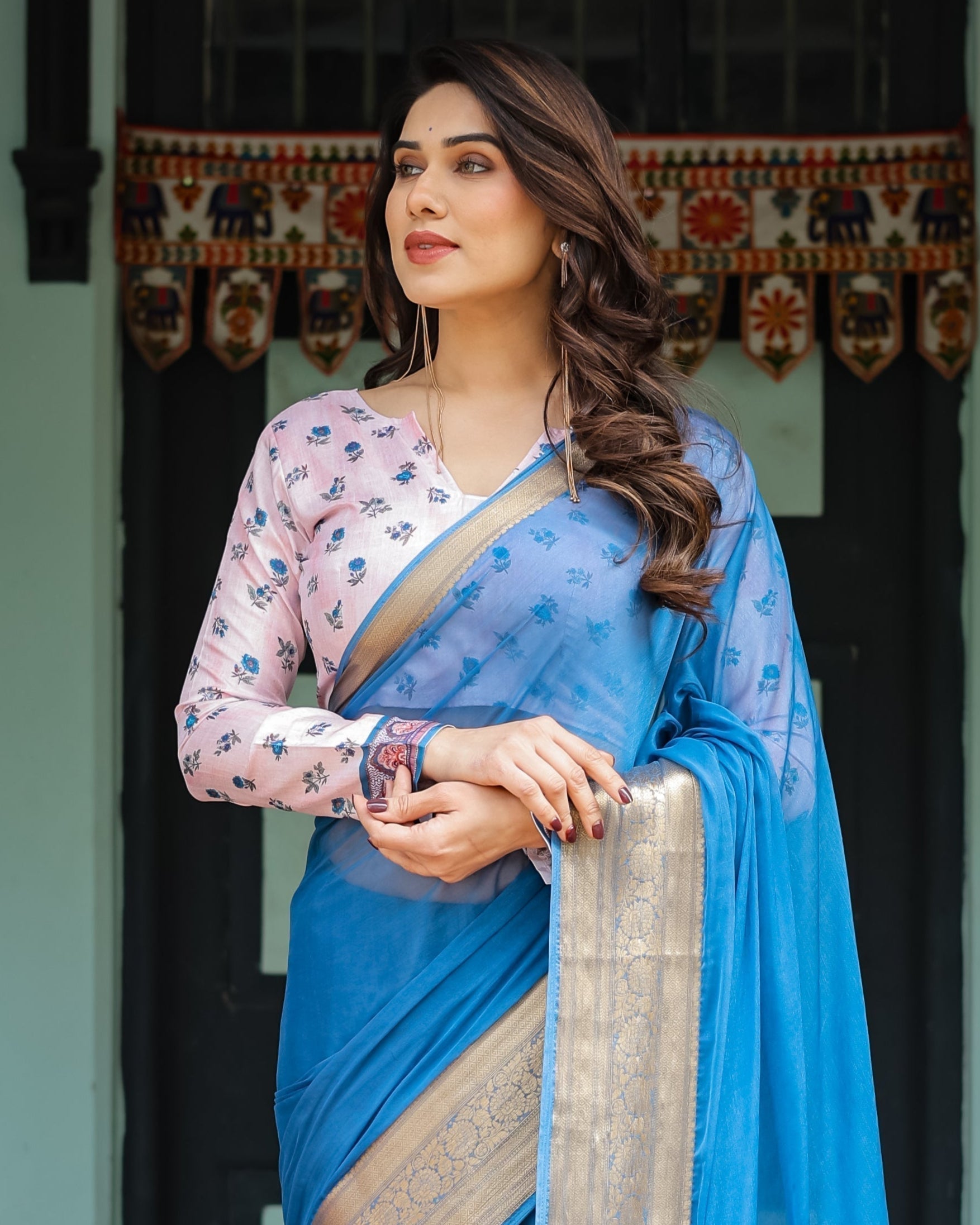 Vibrant Sky Blue Plain Chiffon Saree with Gold Zari Border, Floral Printed Blouse & Tassel Accents CHIFFON
