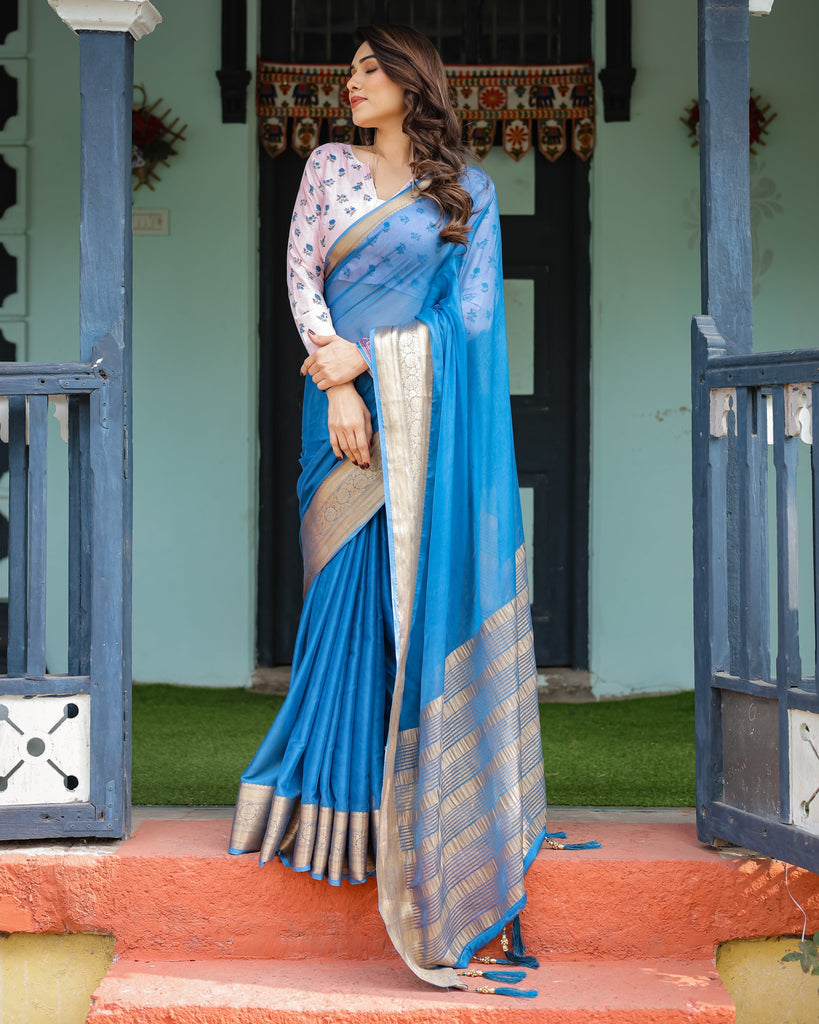 Vibrant Sky Blue Plain Chiffon Saree with Gold Zari Border, Floral Printed Blouse & Tassel Accents CHIFFON