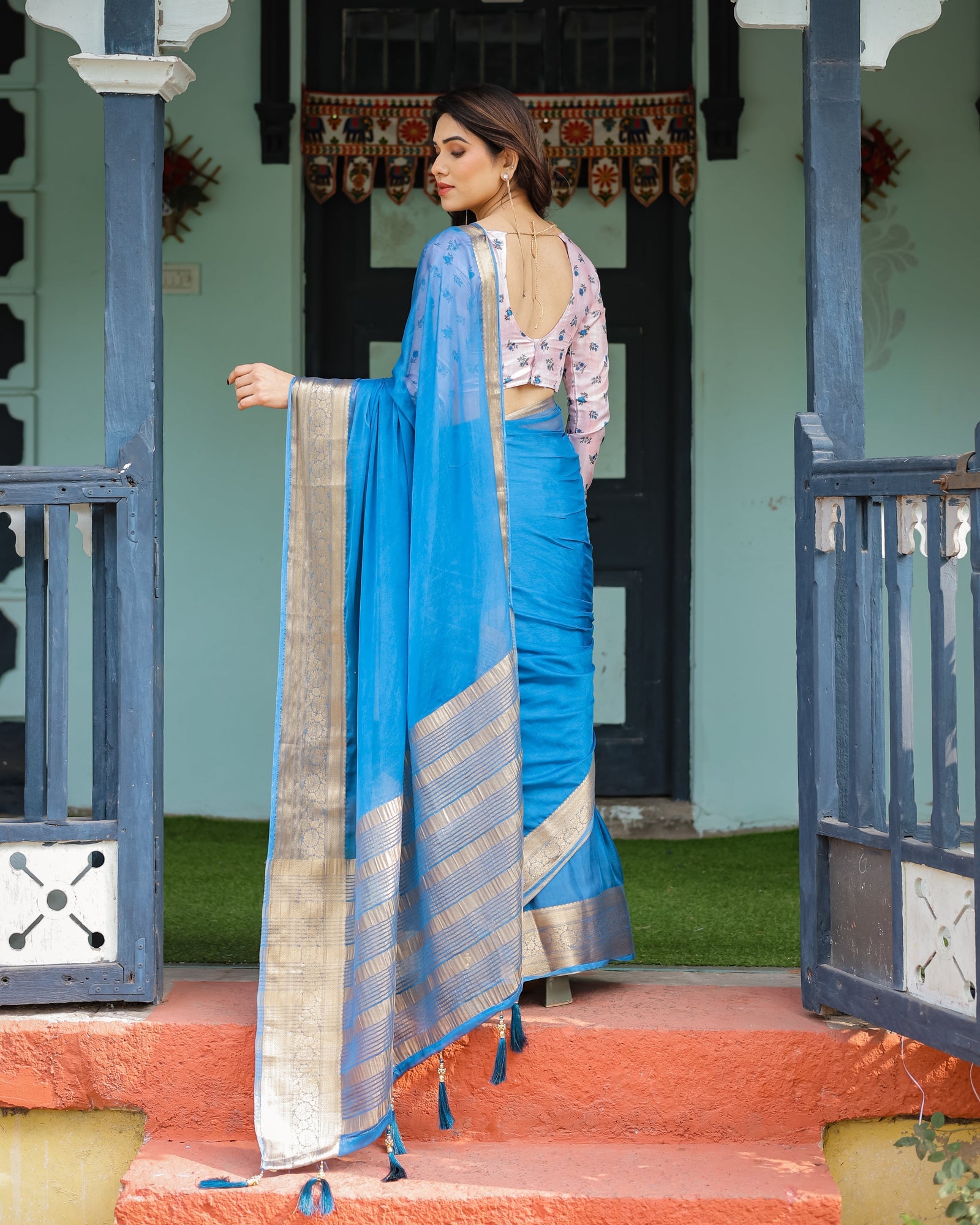 Vibrant Sky Blue Plain Chiffon Saree with Gold Zari Border, Floral Printed Blouse & Tassel Accents CHIFFON