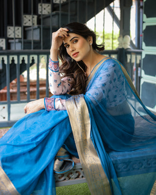 Vibrant Sky Blue Plain Chiffon Saree with Gold Zari Border, Floral Printed Blouse & Tassel Accents CHIFFON