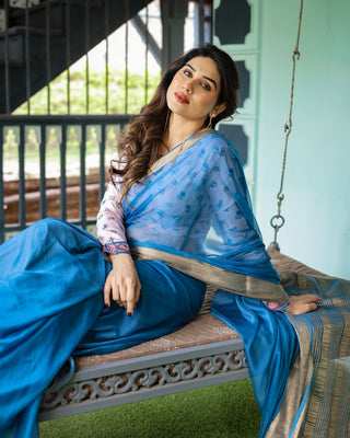Vibrant Sky Blue Plain Chiffon Saree with Gold Zari Border, Floral Printed Blouse & Tassel Accents CHIFFON