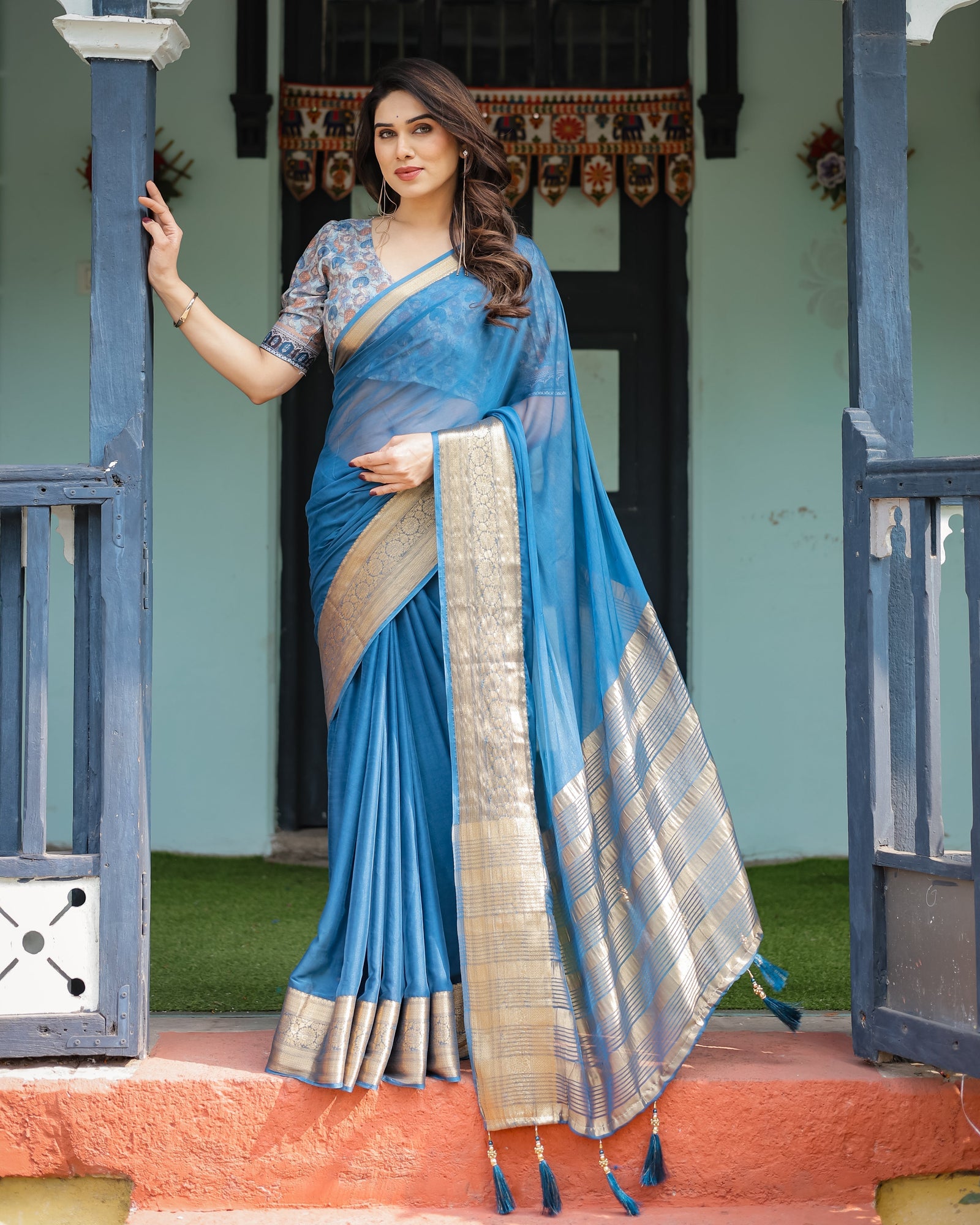 Vibrant Peacock Blue Plain Chiffon Saree with Gold Zari Border, Floral Printed Blouse & Tassel Accents CHIFFON