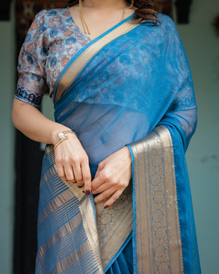 Vibrant Peacock Blue Plain Chiffon Saree with Gold Zari Border, Floral Printed Blouse & Tassel Accents CHIFFON