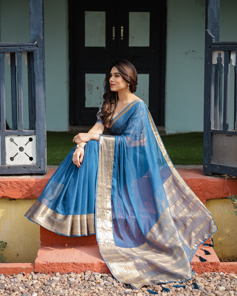 Vibrant Peacock Blue Plain Chiffon Saree with Gold Zari Border, Floral Printed Blouse & Tassel Accents CHIFFON