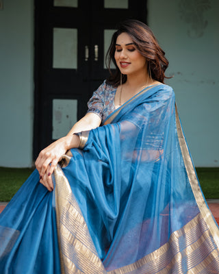 Vibrant Peacock Blue Plain Chiffon Saree with Gold Zari Border, Floral Printed Blouse & Tassel Accents CHIFFON