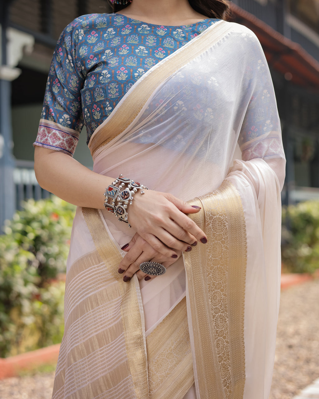Ivory White Plain Chiffon Saree with Gold Zari Border, Floral Printed Blouse & Tassel Detailing CHIFFON