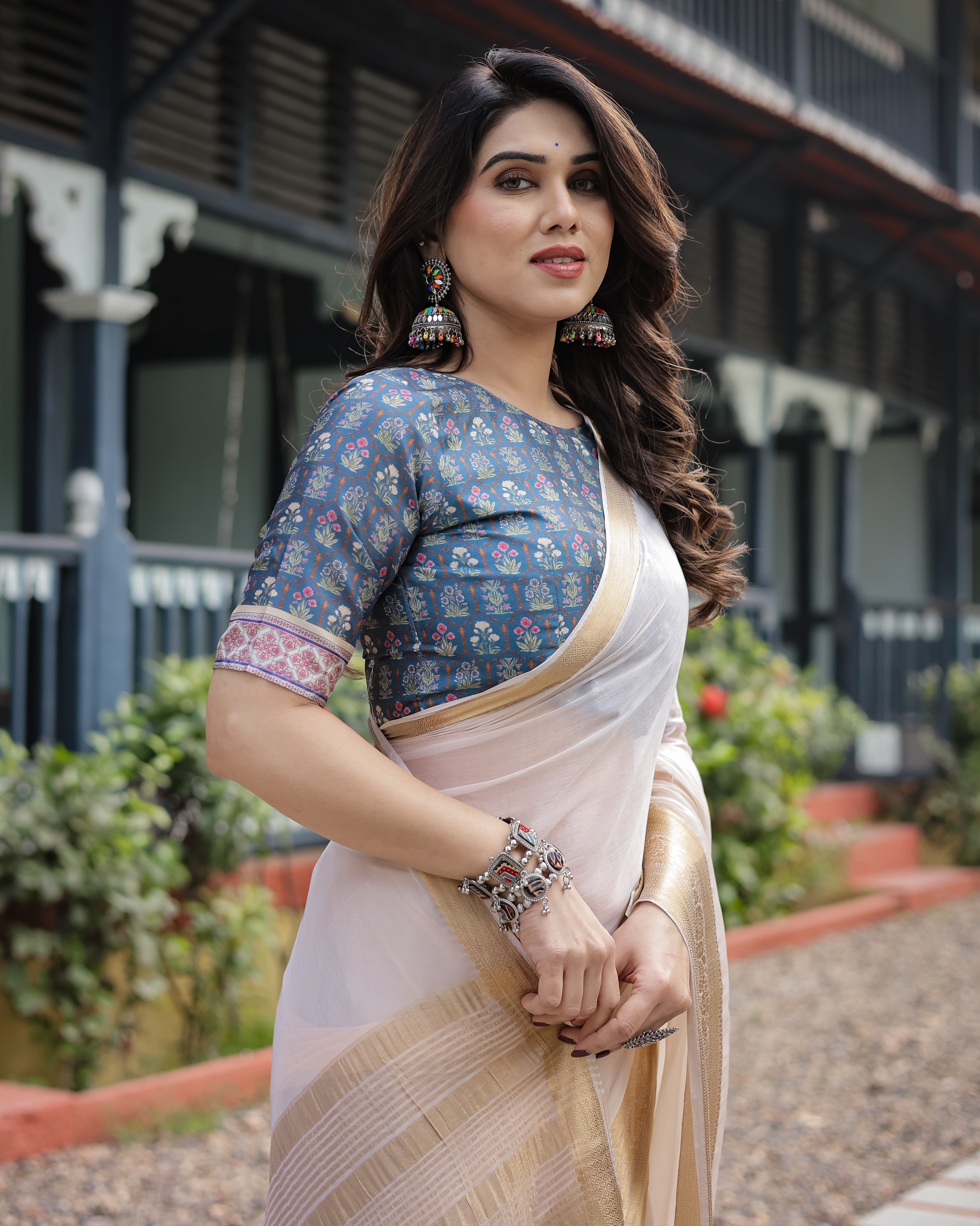 Ivory White Plain Chiffon Saree with Gold Zari Border, Floral Printed Blouse & Tassel Detailing CHIFFON