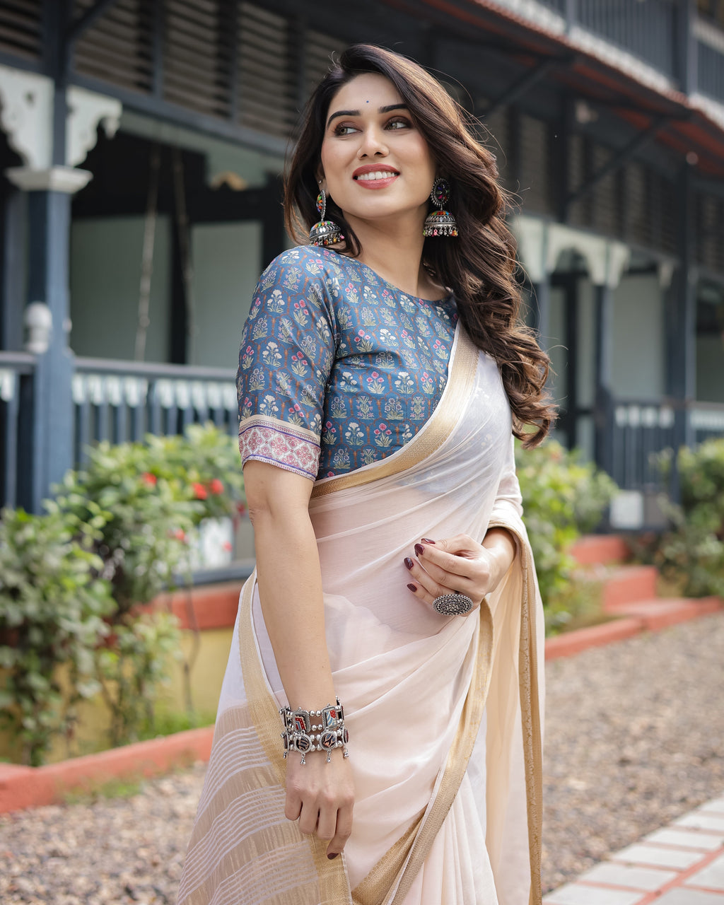 Ivory White Plain Chiffon Saree with Gold Zari Border, Floral Printed Blouse & Tassel Detailing CHIFFON