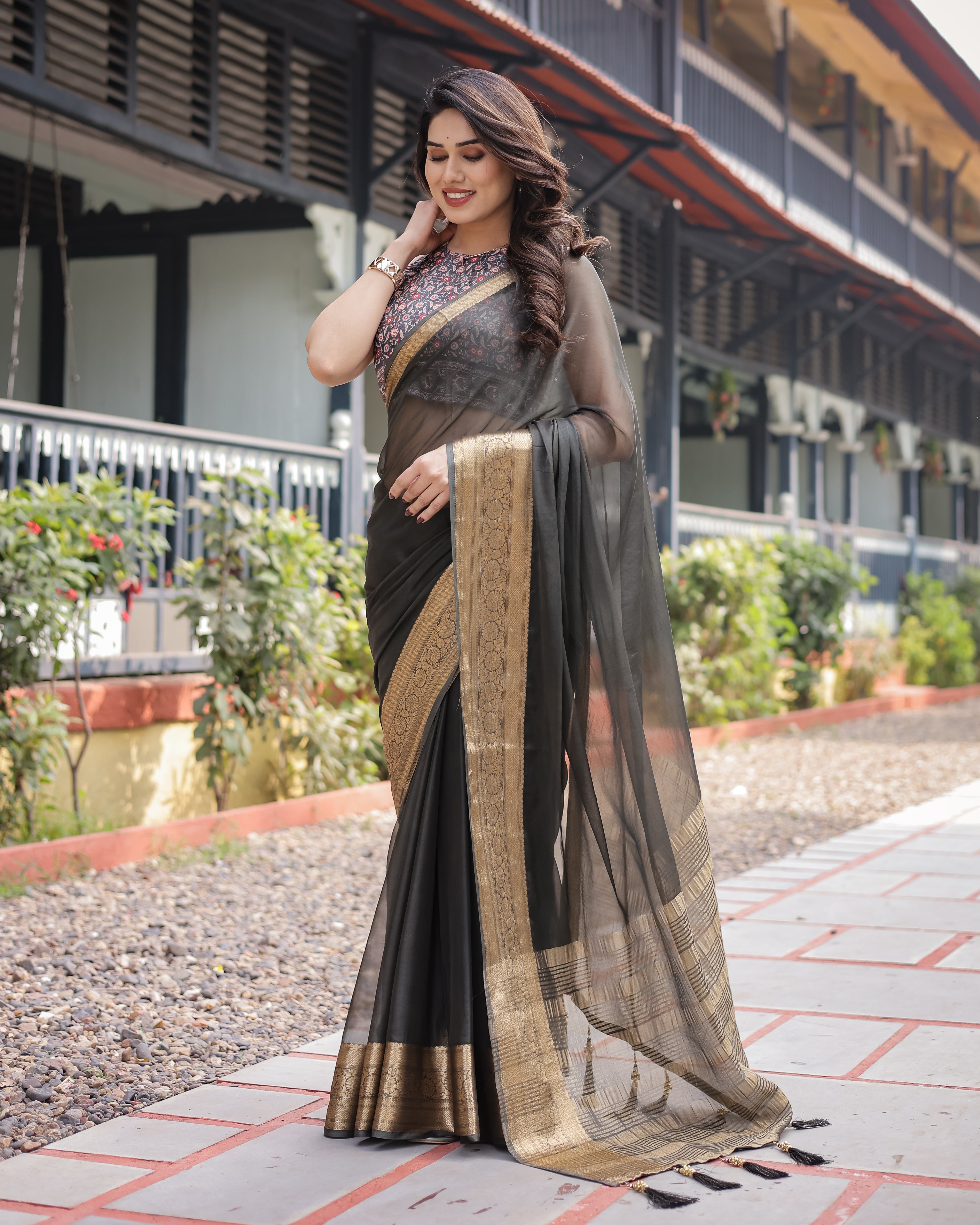 Ethereal Black Plain Chiffon Saree with Gold Zari Border, Floral Printed Blouse & Tassel Detailing Secondary image