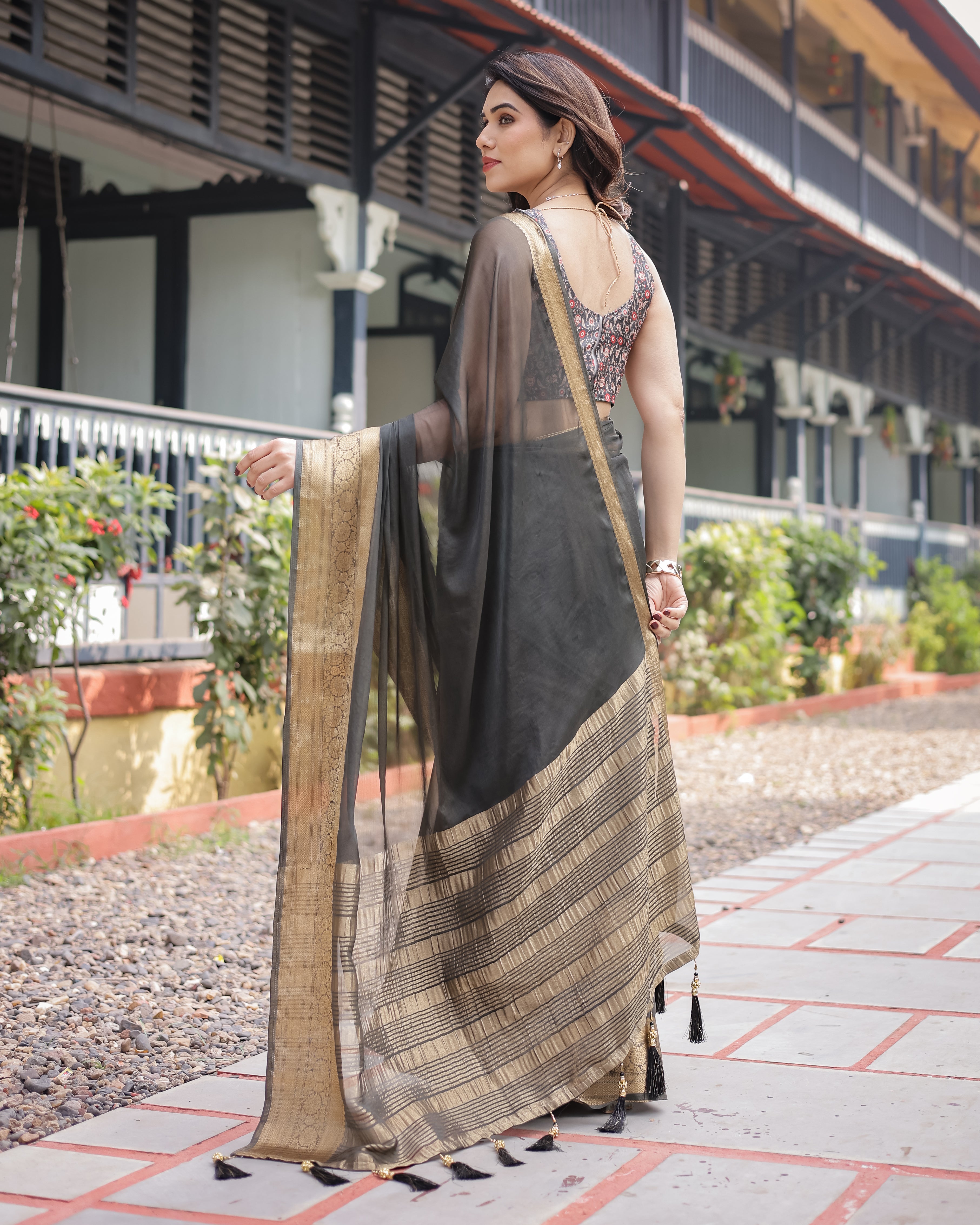 Ethereal Black Plain Chiffon Saree with Gold Zari Border, Floral Printed Blouse & Tassel Detailing CHIFFON
