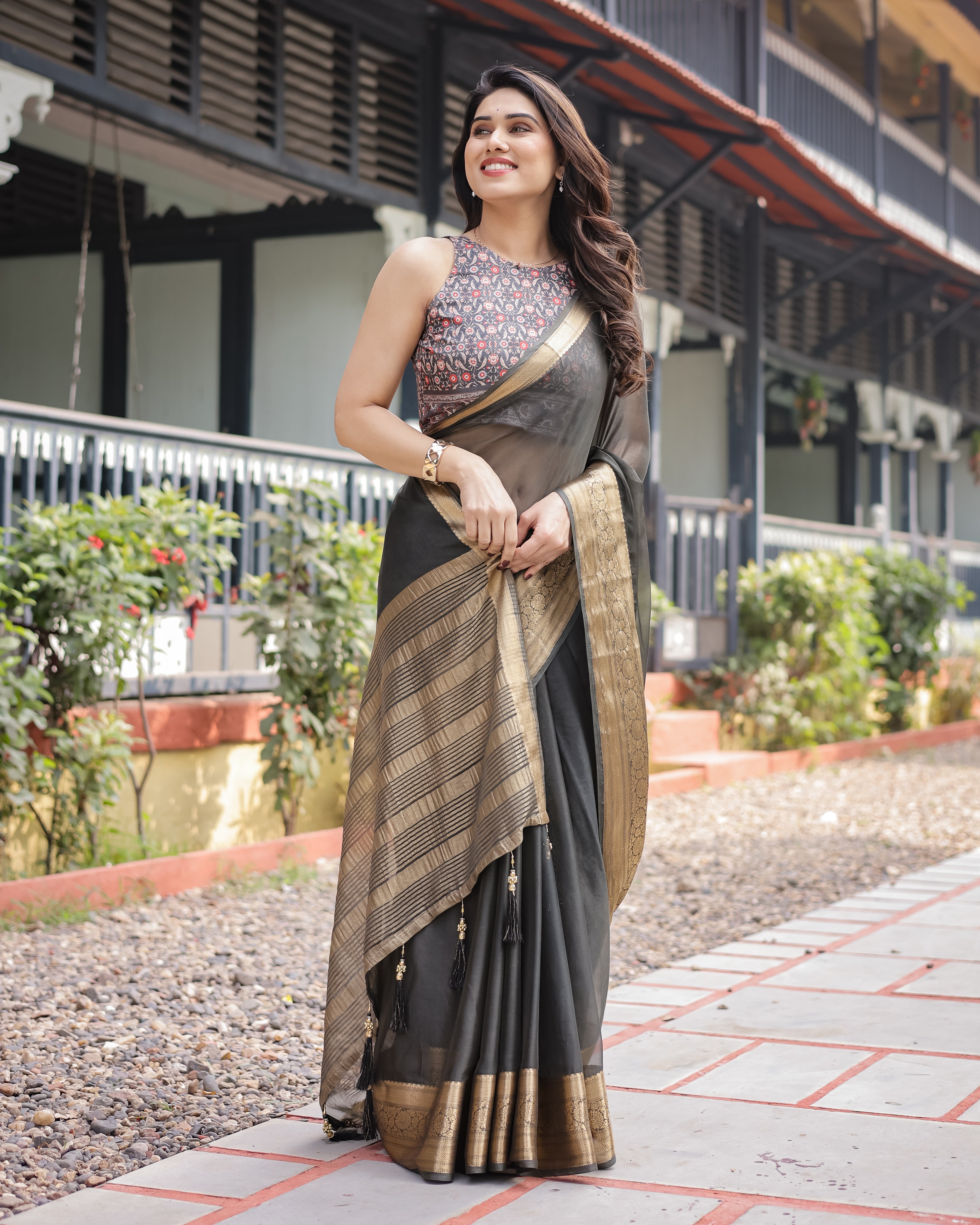 Ethereal Black Plain Chiffon Saree with Gold Zari Border, Floral Printed Blouse & Tassel Detailing CHIFFON