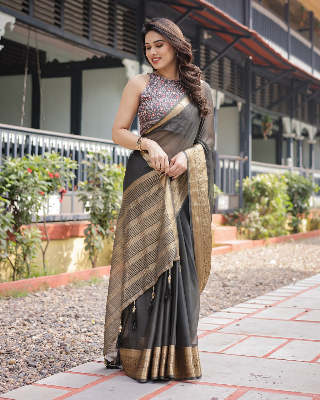 Ethereal Black Plain Chiffon Saree with Gold Zari Border, Floral Printed Blouse & Tassel Detailing CHIFFON