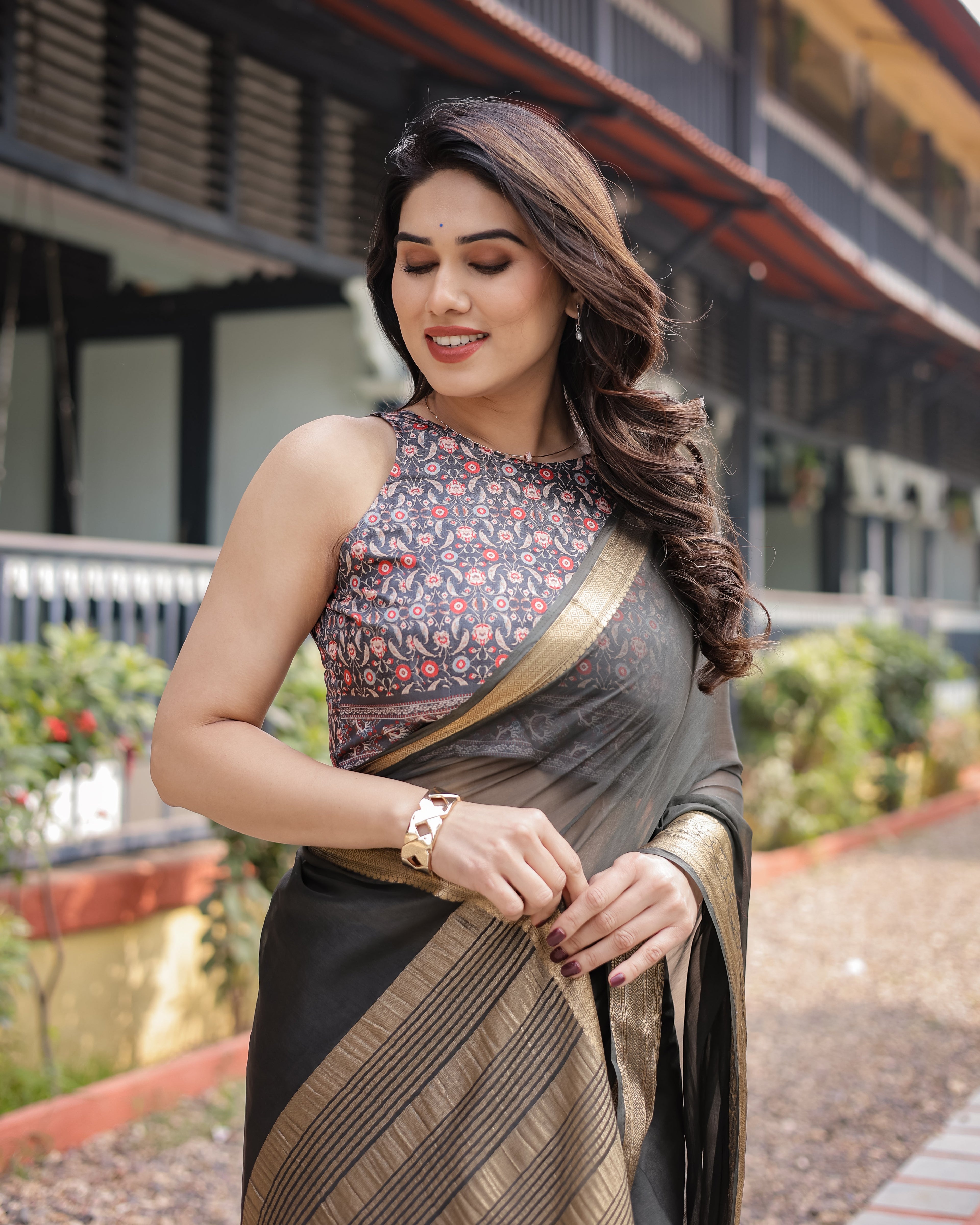 Ethereal Black Plain Chiffon Saree with Gold Zari Border, Floral Printed Blouse & Tassel Detailing CHIFFON