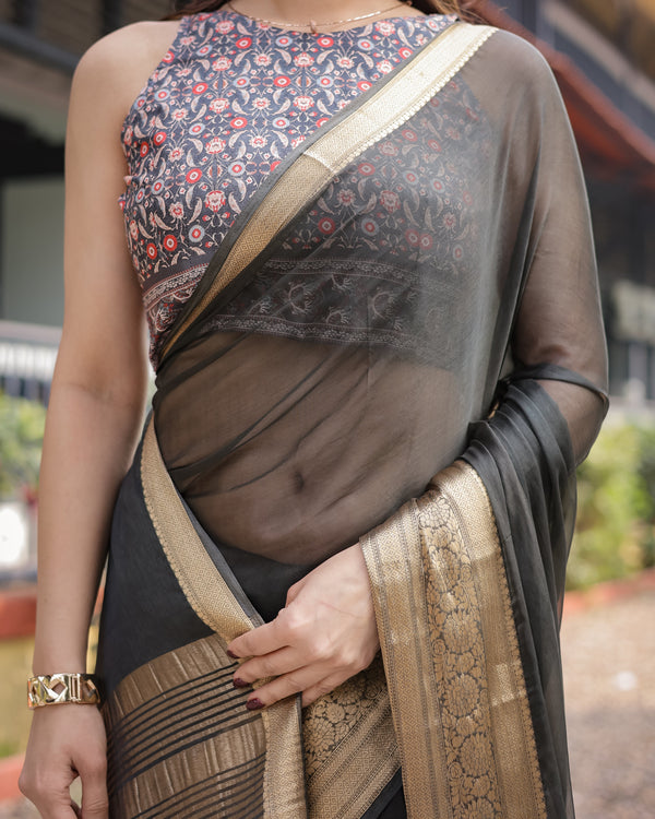 Ethereal Black Plain Chiffon Saree with Gold Zari Border, Floral Printed Blouse & Tassel Detailing CHIFFON