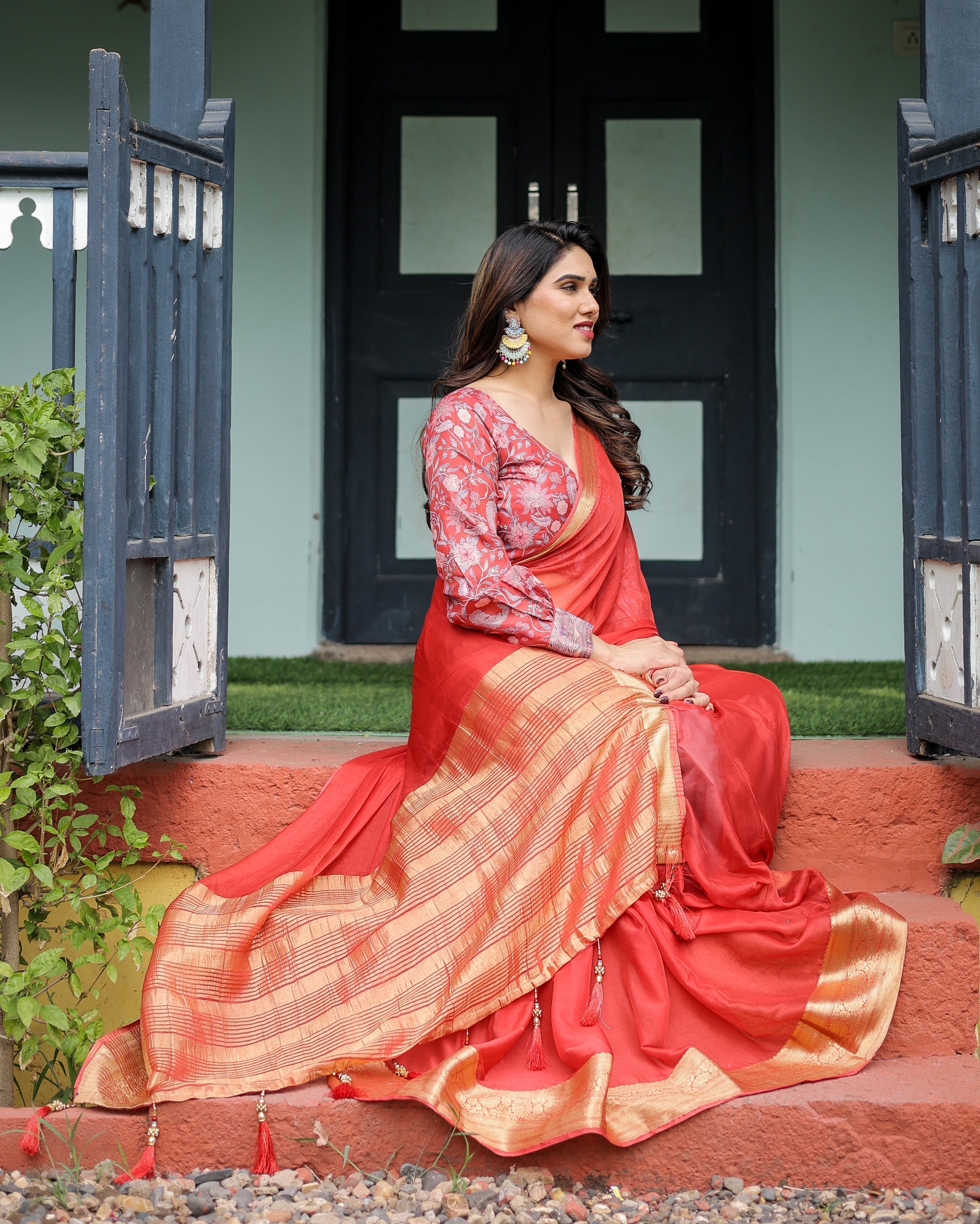 Fiery Red Plain Chiffon Saree with Gold Zari Border, Full-Sleeve Floral Blouse & Tassel Detailing CHIFFON