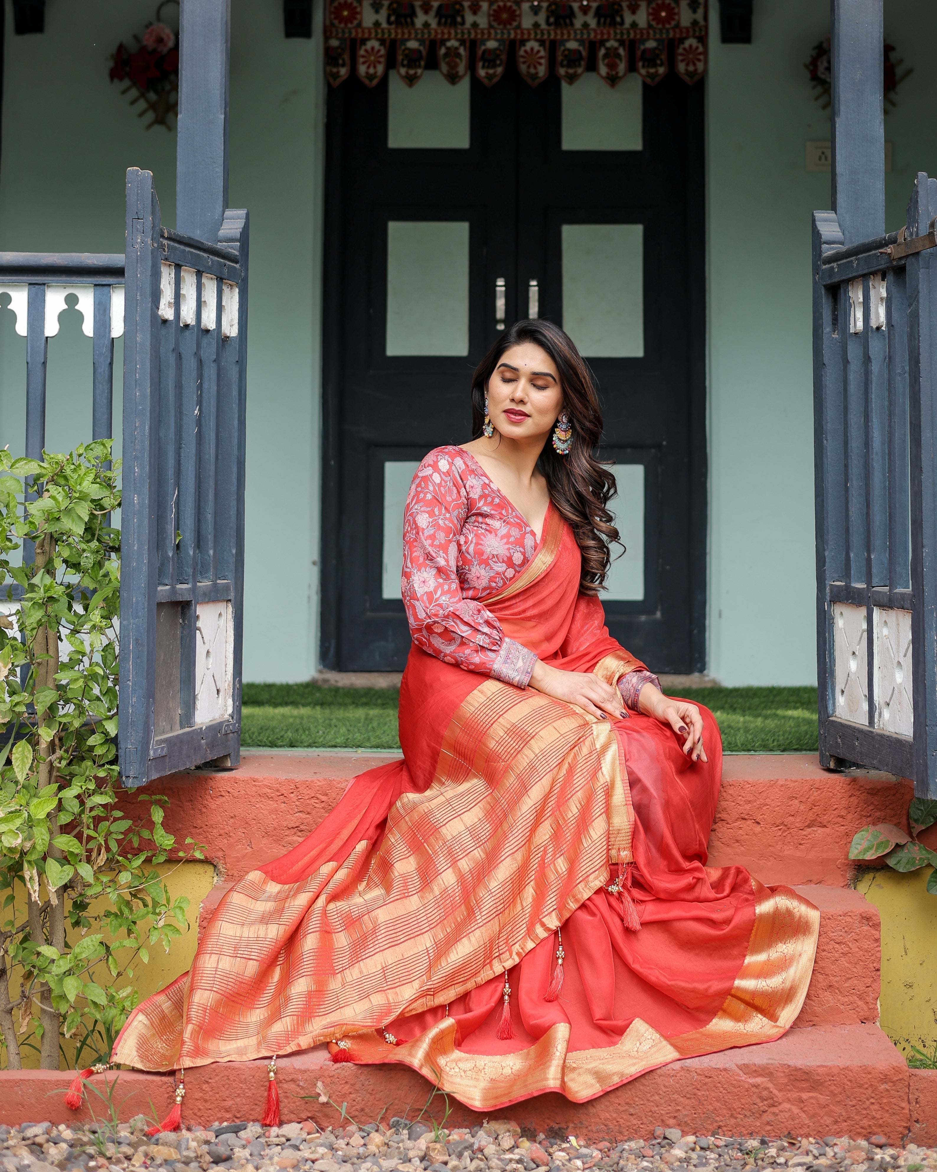 Fiery Red Plain Chiffon Saree with Gold Zari Border, Full-Sleeve Floral Blouse & Tassel Detailing CHIFFON