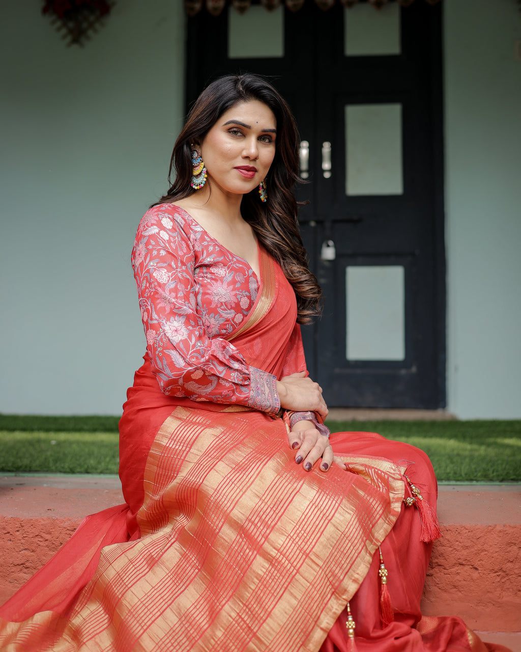 Fiery Red Plain Chiffon Saree with Gold Zari Border, Full-Sleeve Floral Blouse & Tassel Detailing CHIFFON