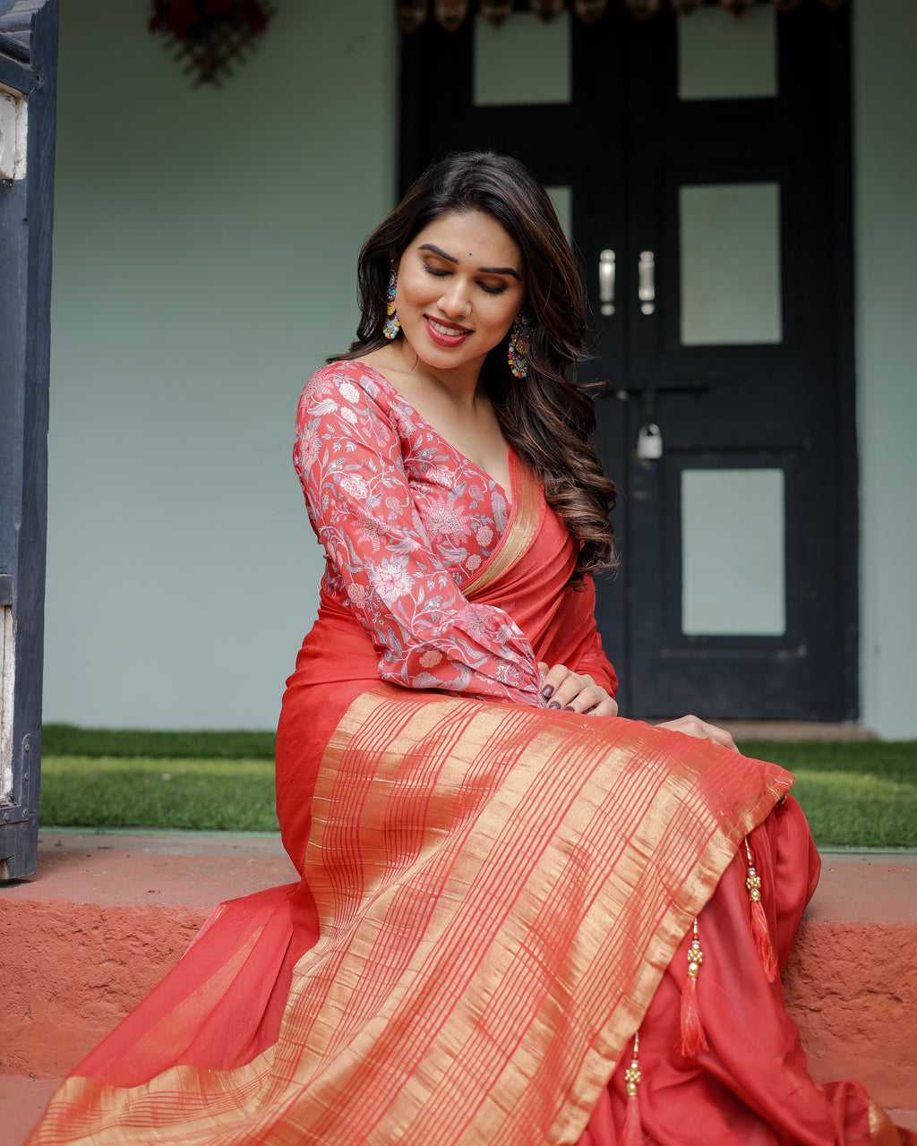 Fiery Red Plain Chiffon Saree with Gold Zari Border, Full-Sleeve Floral Blouse & Tassel Detailing CHIFFON