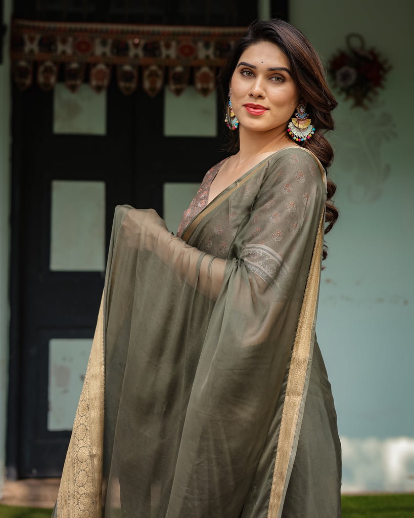 Elegant Olive Green Plain Chiffon Saree with Gold Zari Border, Floral Printed Blouse & Tassel Detailing CHIFFON