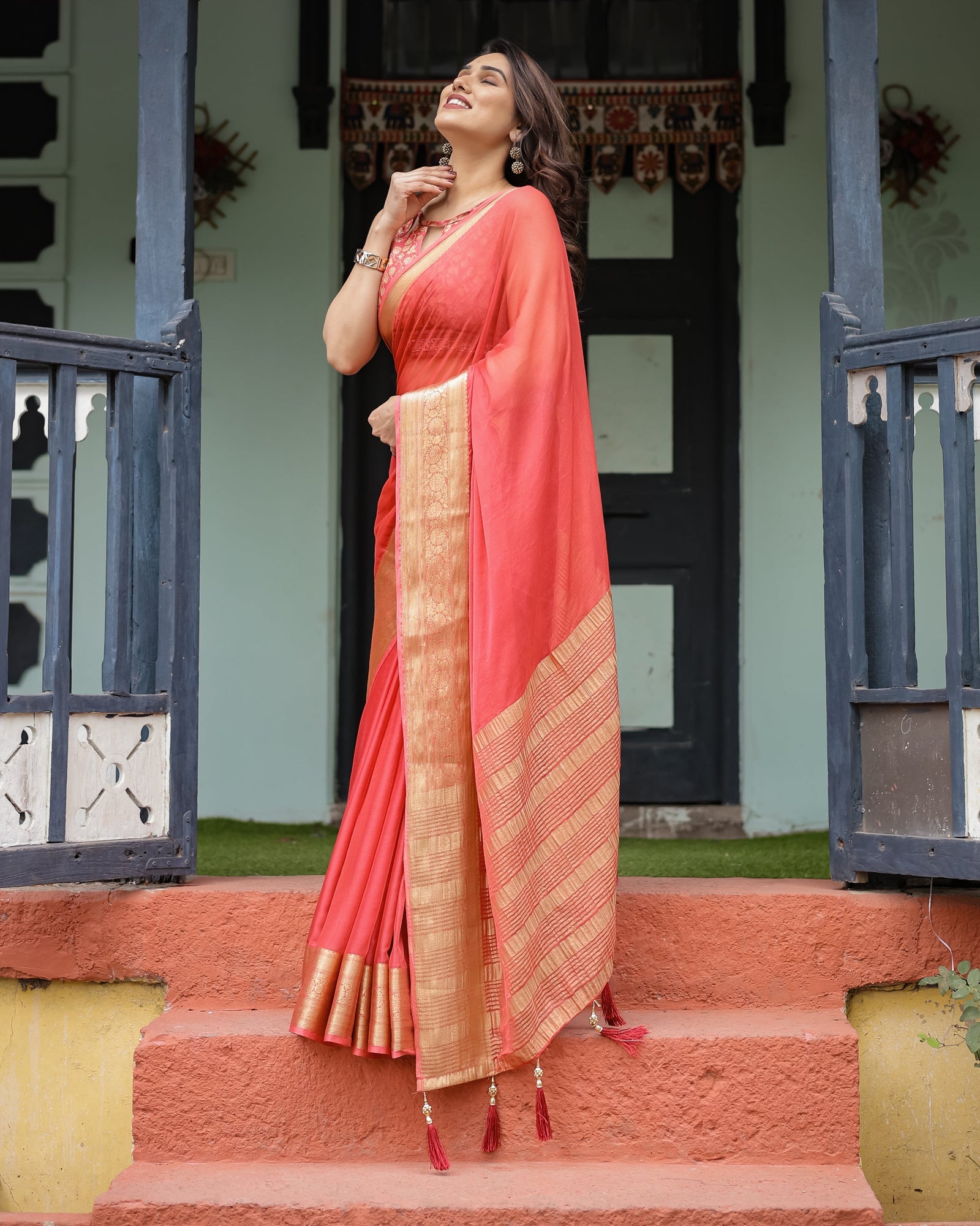 Graceful Coral Pink Plain Chiffon Saree with Gold Zari Border, Floral Embroidered Blouse & Tassel Detailing CHIFFON