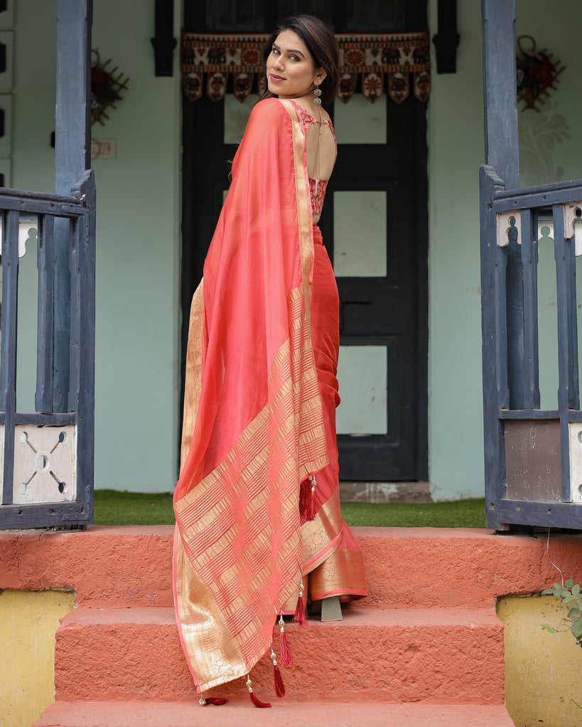 Graceful Coral Pink Plain Chiffon Saree with Gold Zari Border, Floral Embroidered Blouse & Tassel Detailing CHIFFON
