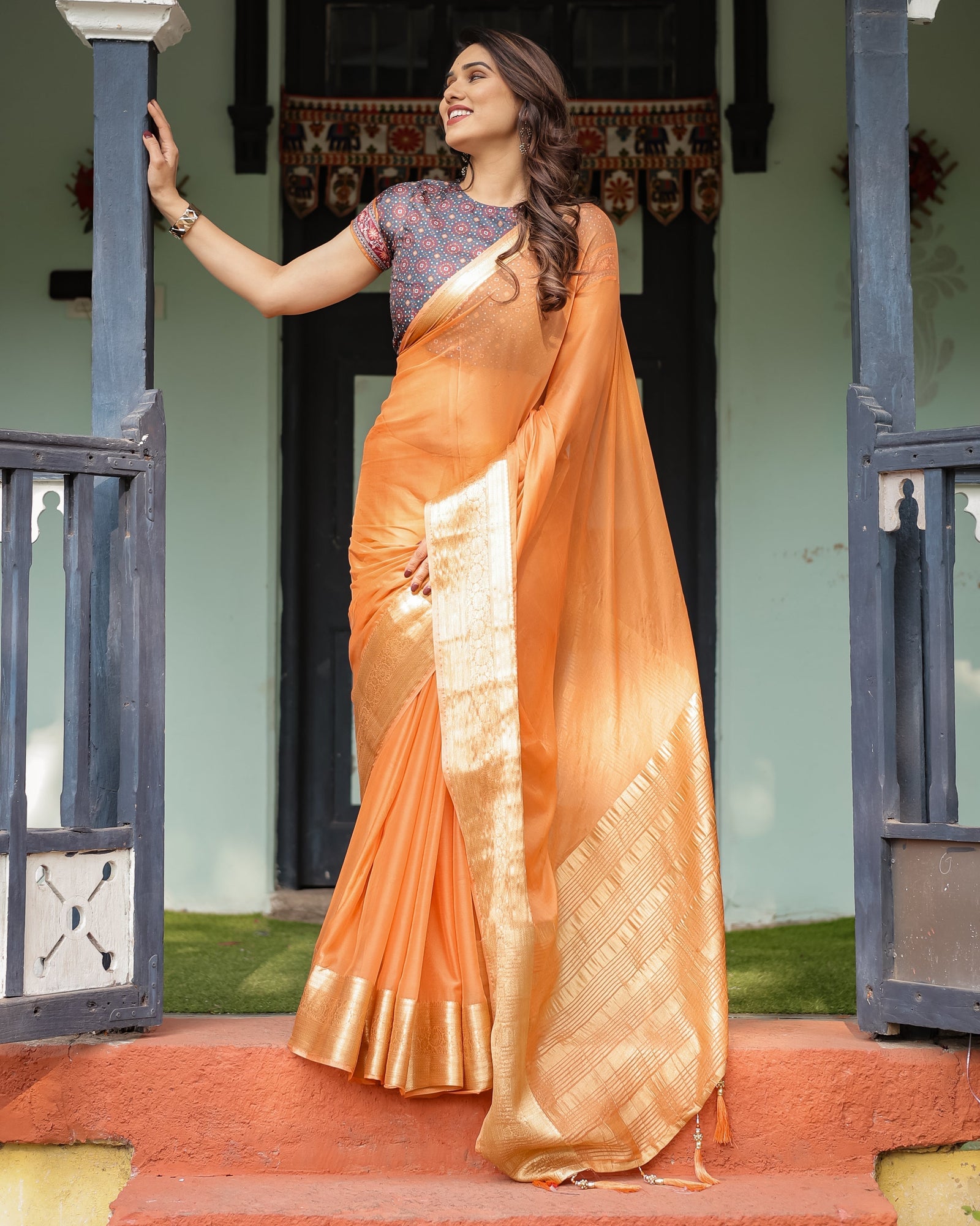 Elegant Tangerine Orange Plain Chiffon Saree with Gold Zari Border, Geometric Printed Blouse & Tassel Detailing CHIFFON