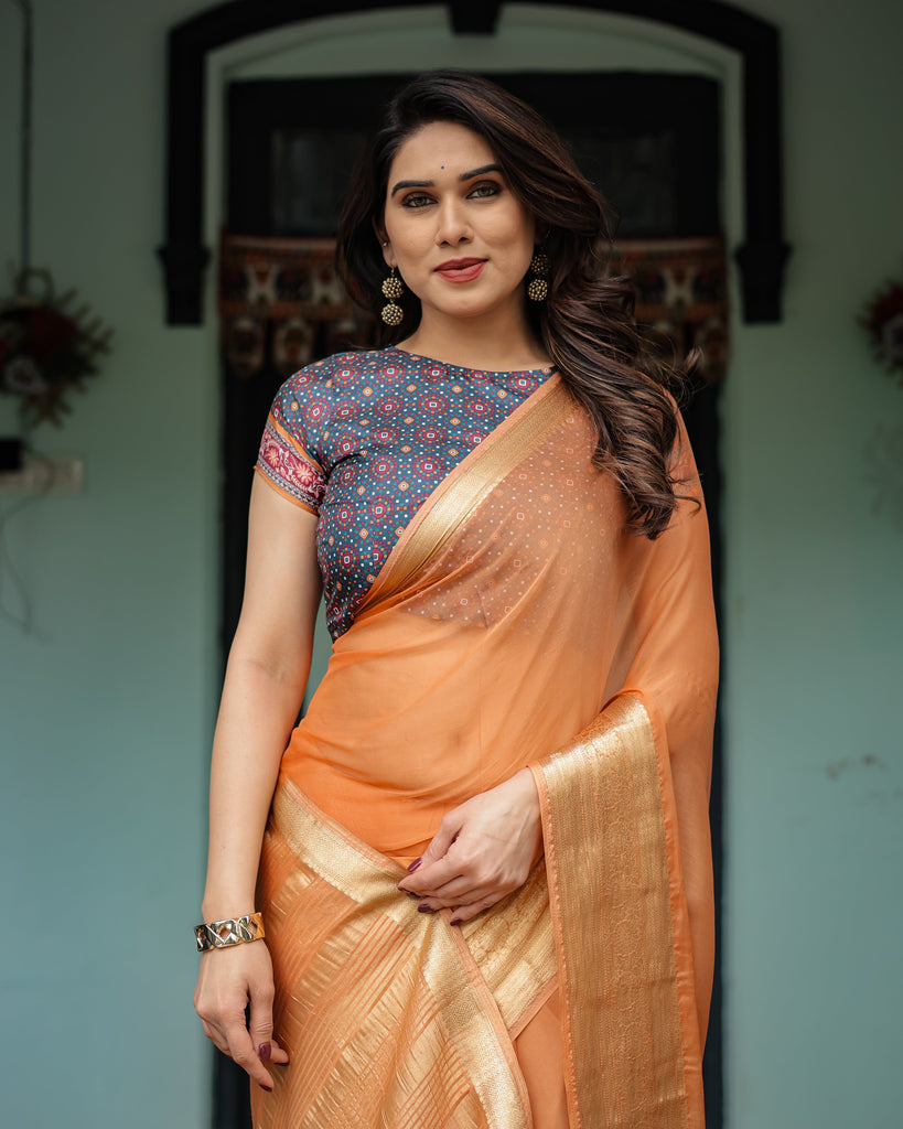 Elegant Tangerine Orange Plain Chiffon Saree with Gold Zari Border, Geometric Printed Blouse & Tassel Detailing CHIFFON