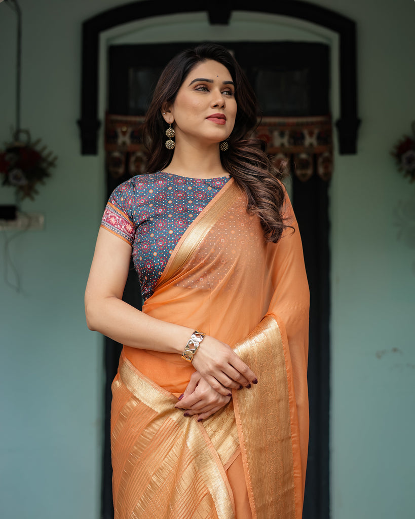 Elegant Tangerine Orange Plain Chiffon Saree with Gold Zari Border, Geometric Printed Blouse & Tassel Detailing CHIFFON