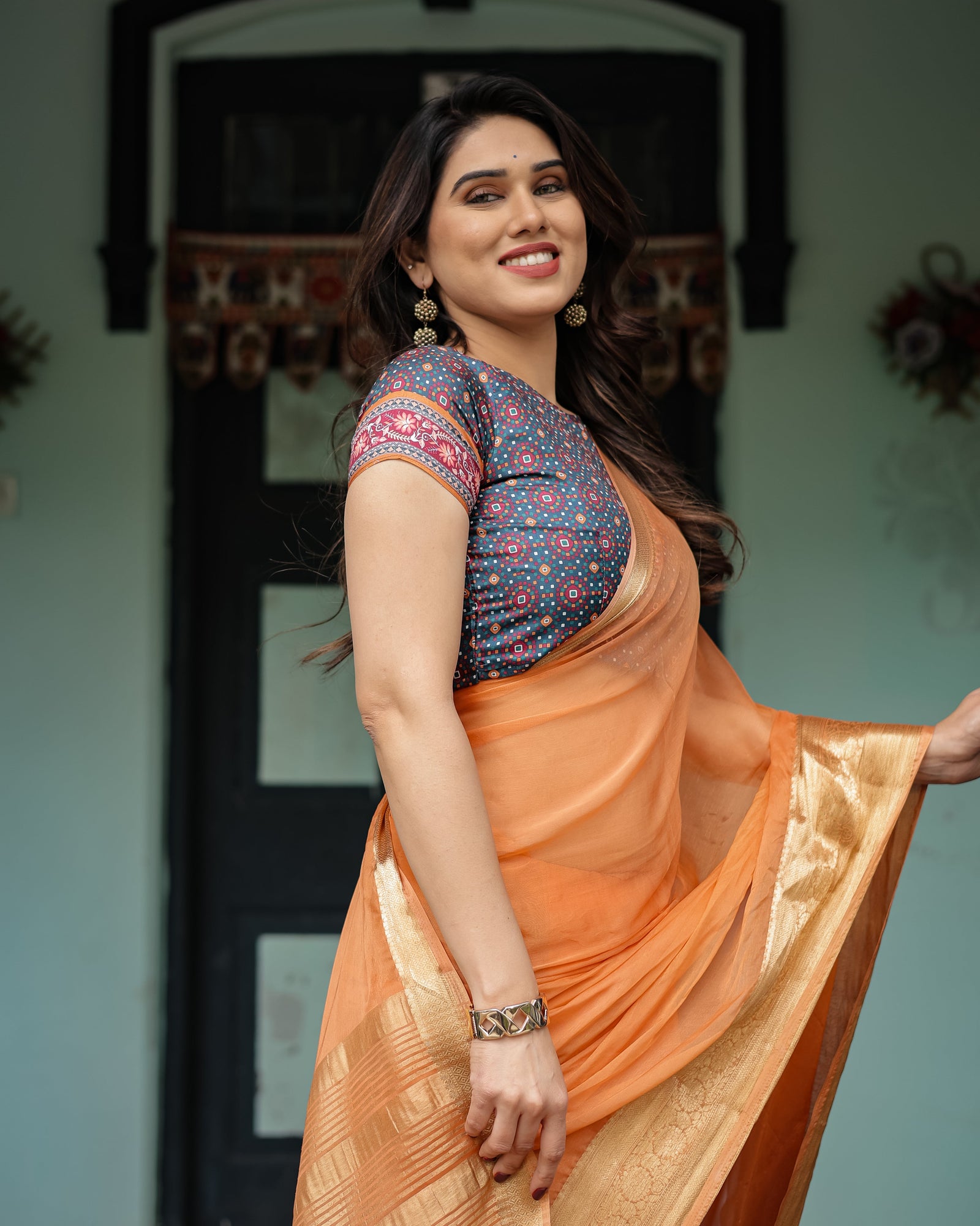 Elegant Tangerine Orange Plain Chiffon Saree with Gold Zari Border, Geometric Printed Blouse & Tassel Detailing CHIFFON