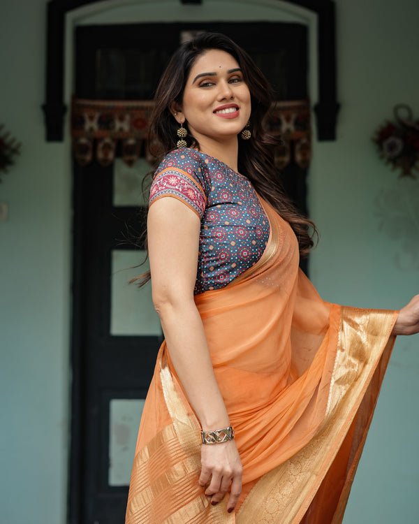 Elegant Tangerine Orange Plain Chiffon Saree with Gold Zari Border, Geometric Printed Blouse & Tassel Detailing CHIFFON