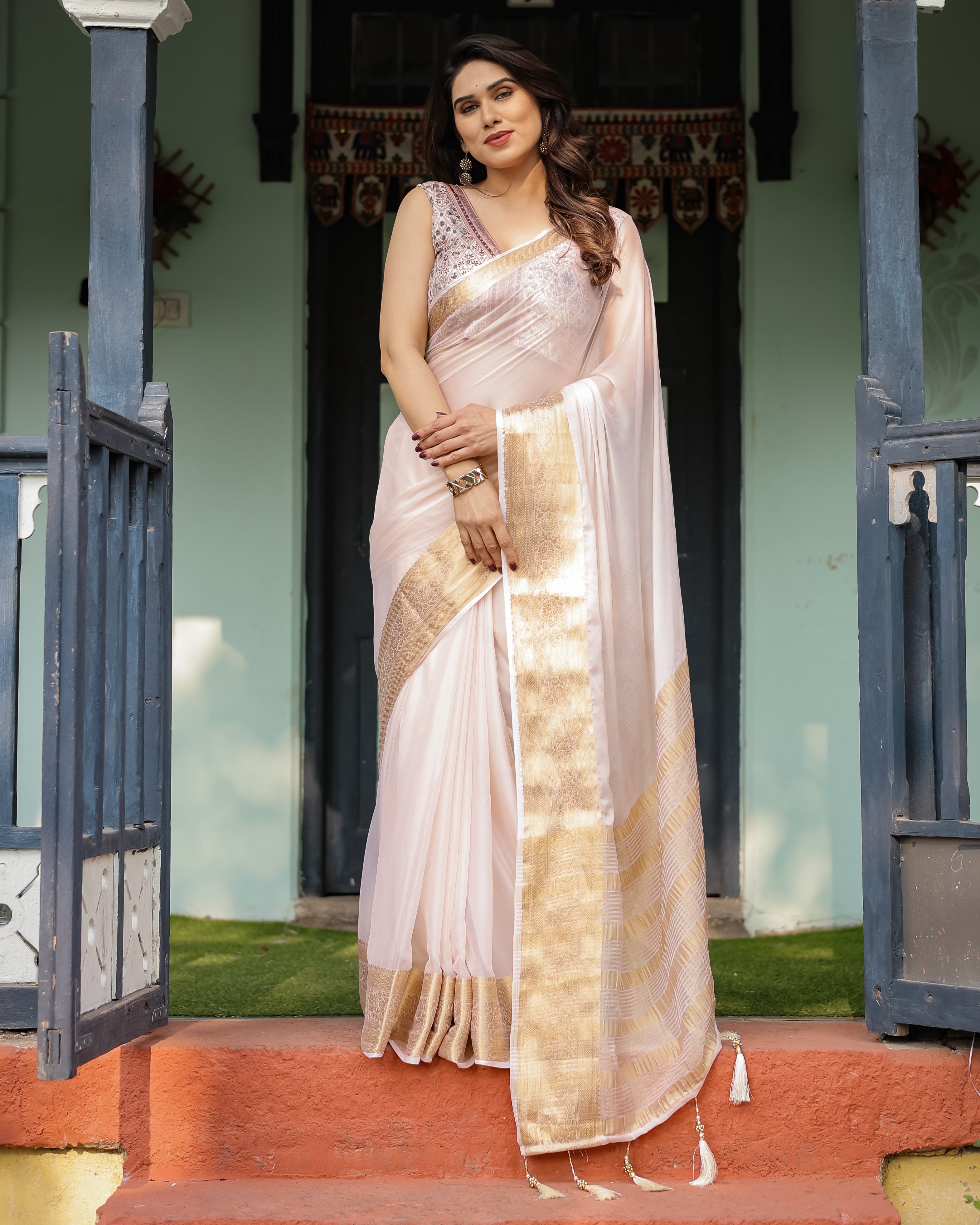 Ethereal Off-White Plain Chiffon Saree with Gold Zari Border, Intricate Floral Printed Blouse & Tassel Detailing Secondary image