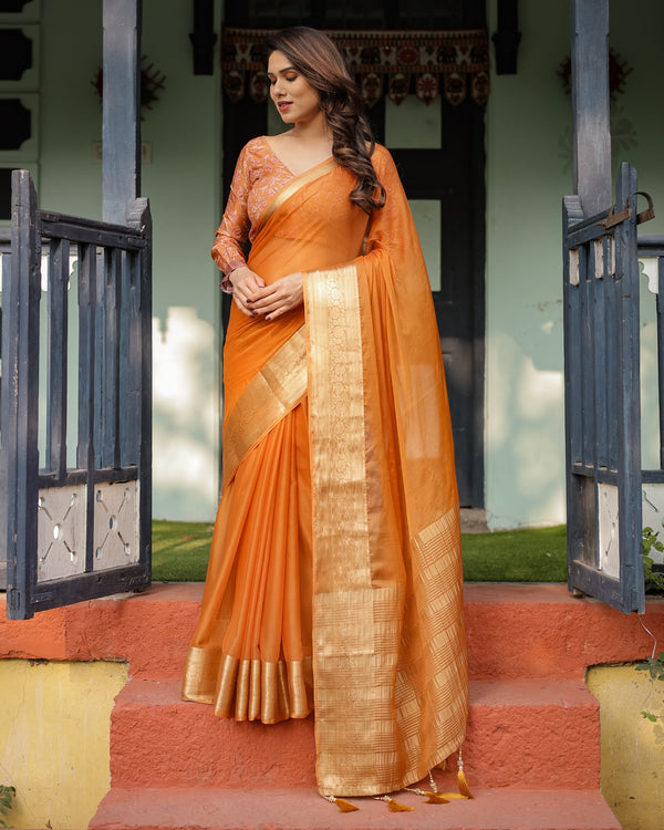 Sunset Orange Plain Chiffon Saree with Gold Zari Border, Floral Embroidered Blouse & Tassel Detailing CHIFFON