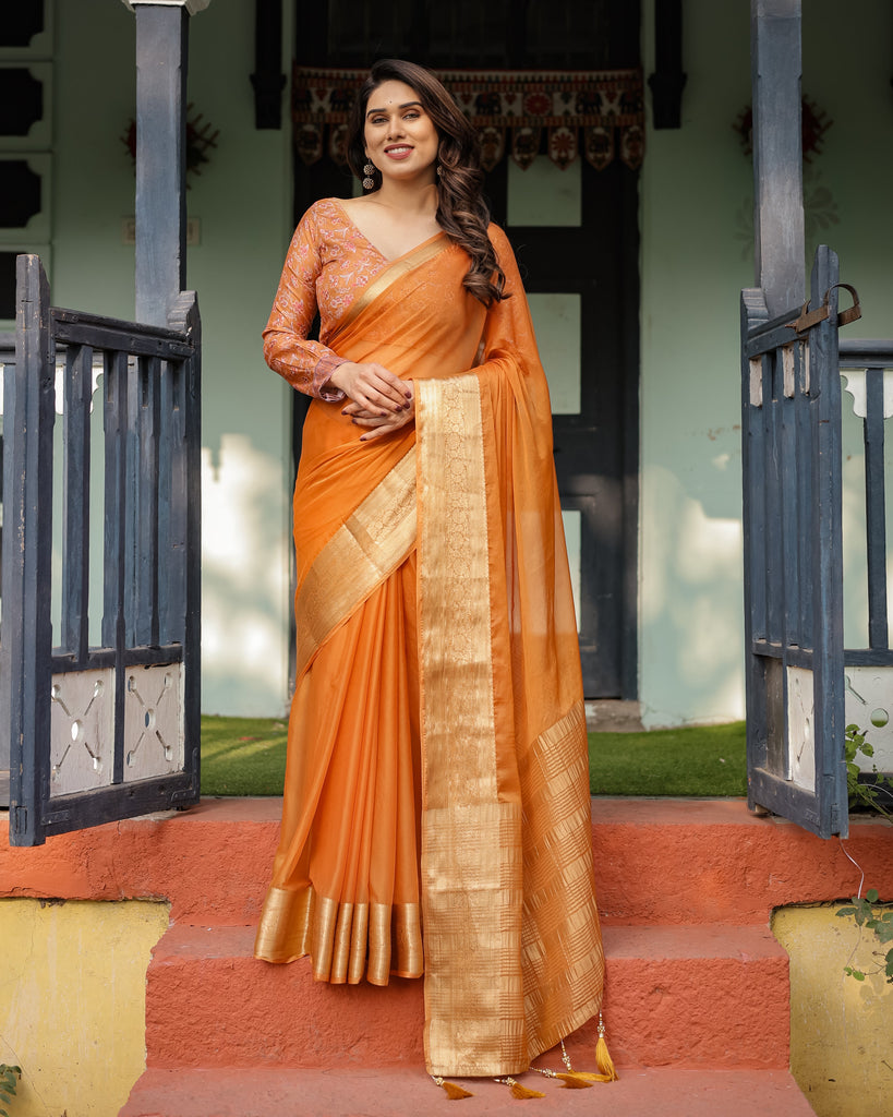 Sunset Orange Plain Chiffon Saree with Gold Zari Border, Floral Embroidered Blouse & Tassel Detailing CHIFFON