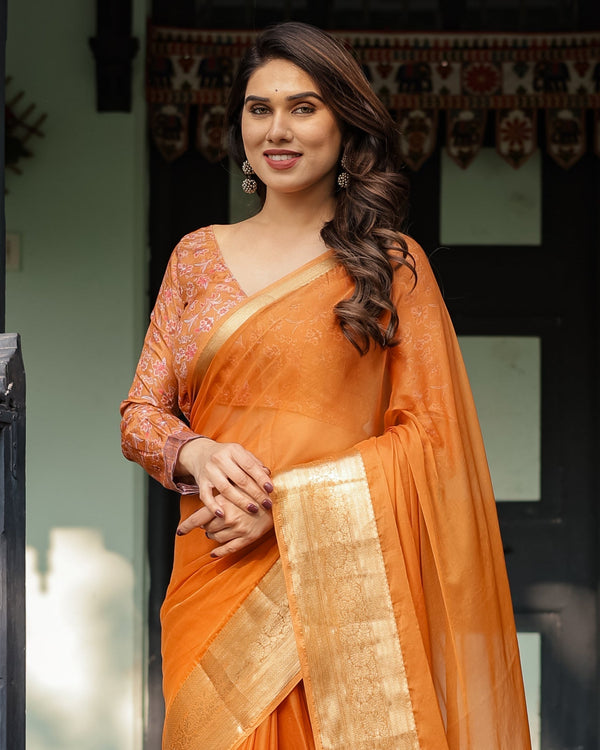 Sunset Orange Plain Chiffon Saree with Gold Zari Border, Floral Embroidered Blouse & Tassel Detailing CHIFFON