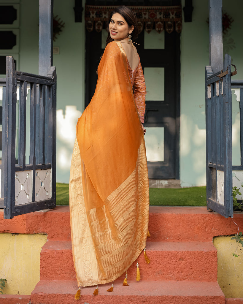 Sunset Orange Plain Chiffon Saree with Gold Zari Border, Floral Embroidered Blouse & Tassel Detailing CHIFFON