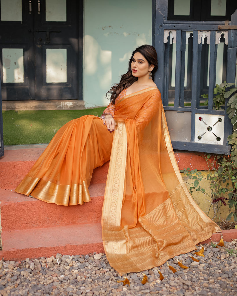 Sunset Orange Plain Chiffon Saree with Gold Zari Border, Floral Embroidered Blouse & Tassel Detailing CHIFFON