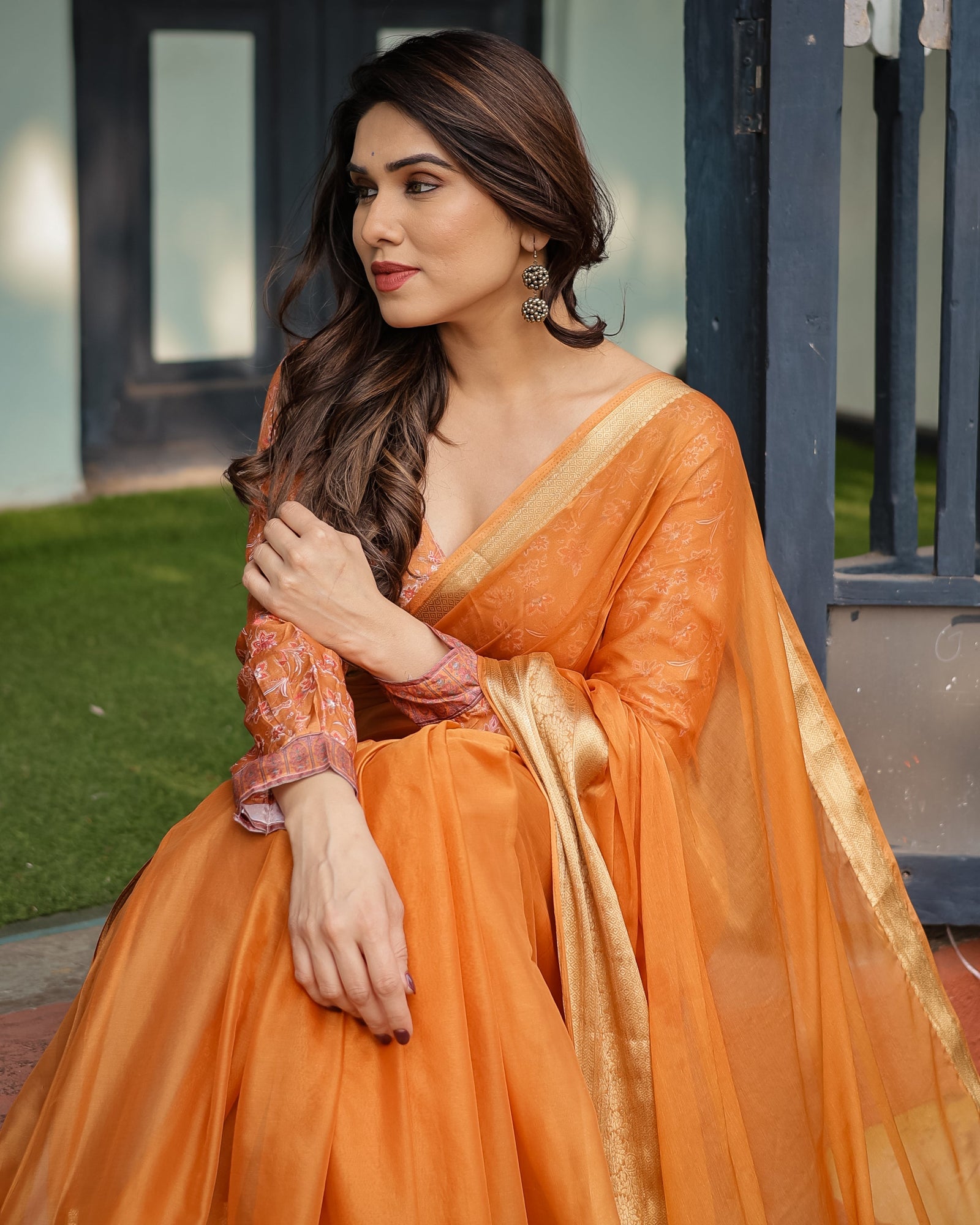 Sunset Orange Plain Chiffon Saree with Gold Zari Border, Floral Embroidered Blouse & Tassel Detailing CHIFFON