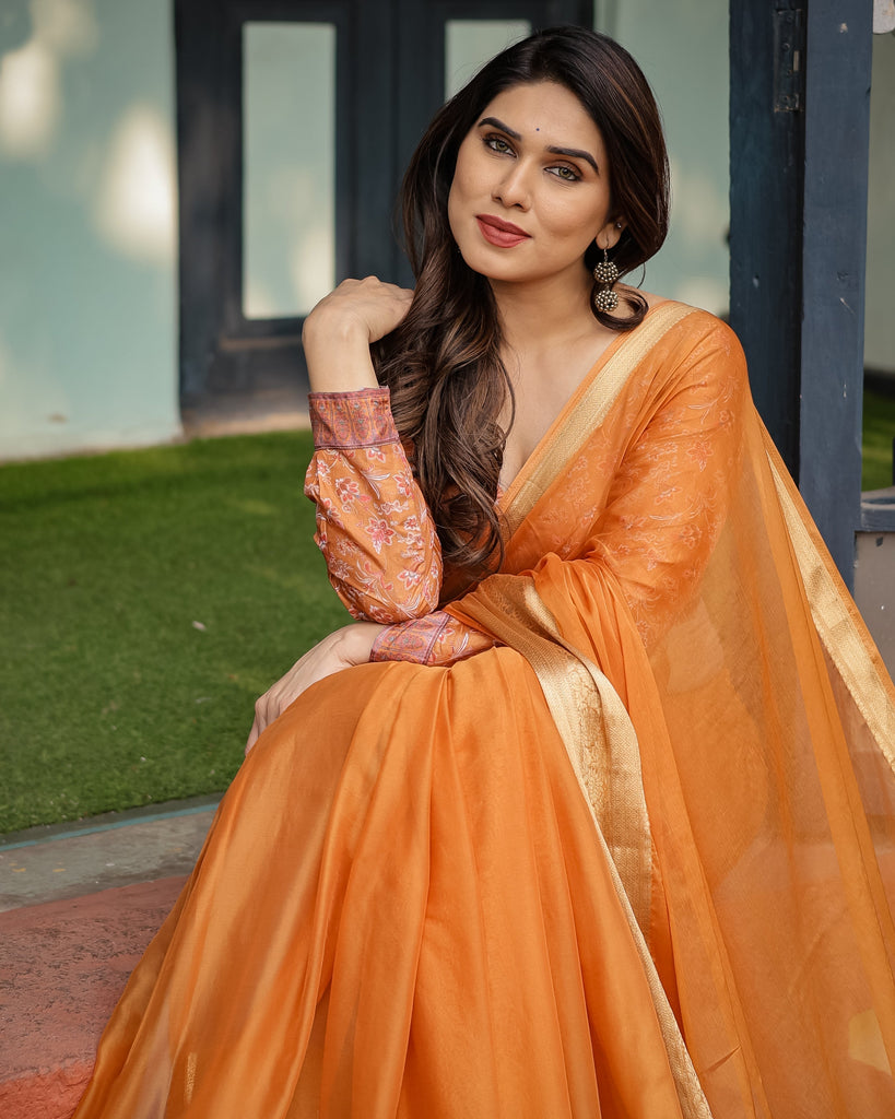 Sunset Orange Plain Chiffon Saree with Gold Zari Border, Floral Embroidered Blouse & Tassel Detailing CHIFFON