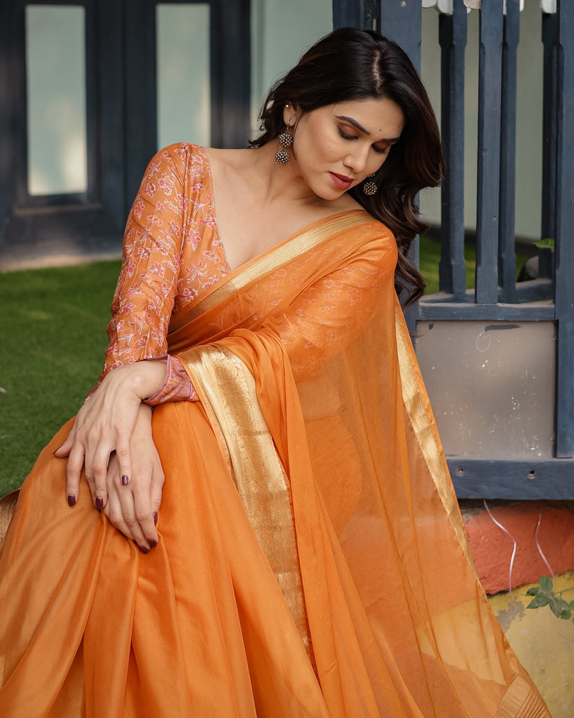 Sunset Orange Plain Chiffon Saree with Gold Zari Border, Floral Embroidered Blouse & Tassel Detailing CHIFFON