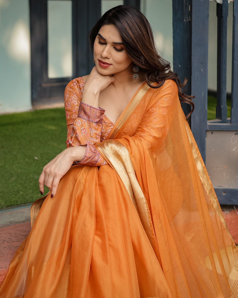 Sunset Orange Plain Chiffon Saree with Gold Zari Border, Floral Embroidered Blouse & Tassel Detailing CHIFFON