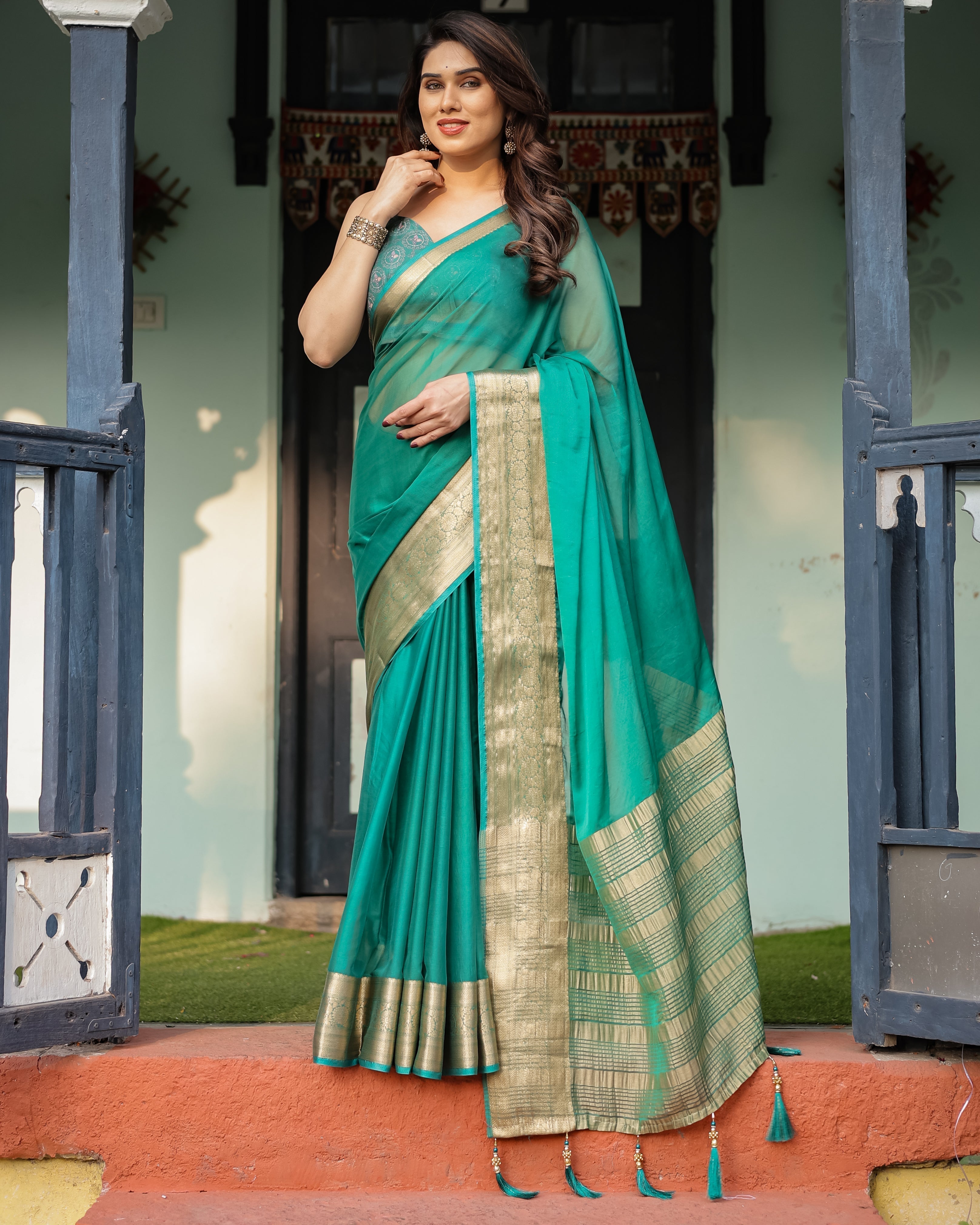 Elegant Sea Green Plain Chiffon Saree with Gold Zari Border, Paisley Printed Blouse & Tassel Detailing CHIFFON