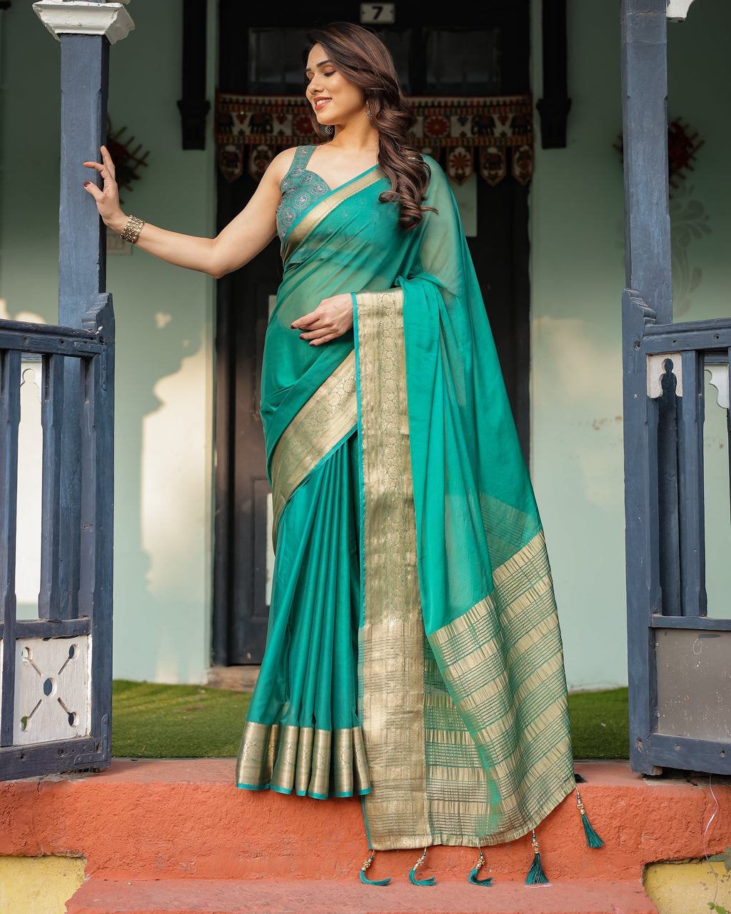 Elegant Sea Green Plain Chiffon Saree with Gold Zari Border, Paisley Printed Blouse & Tassel Detailing CHIFFON